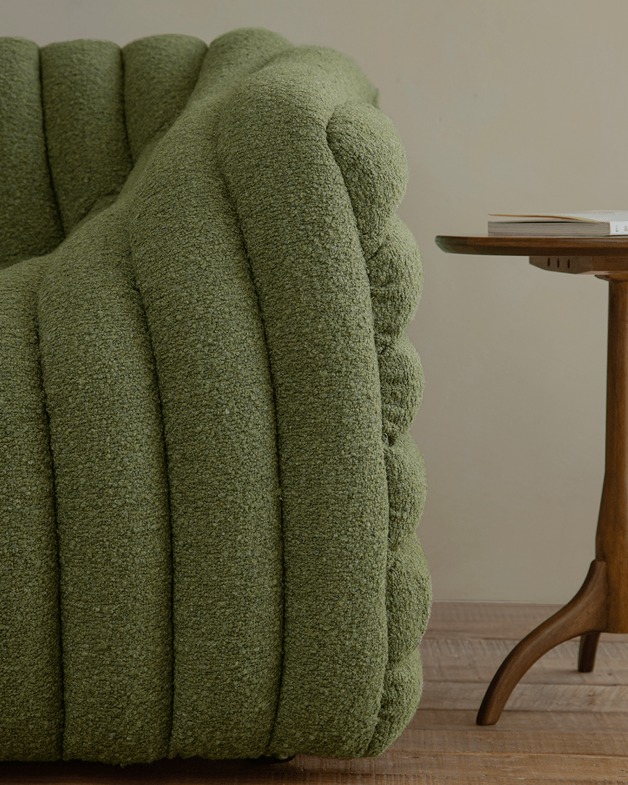 Miche Sofa in green, ribbed design, soft fabric, accentuating cozy living space.