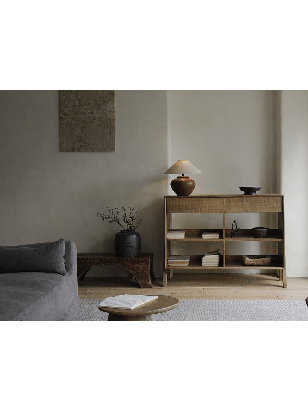 NO.0 Sideboard in natural reclaimed wood with lamp and decor; vintage storage solution, books and objects on shelves.