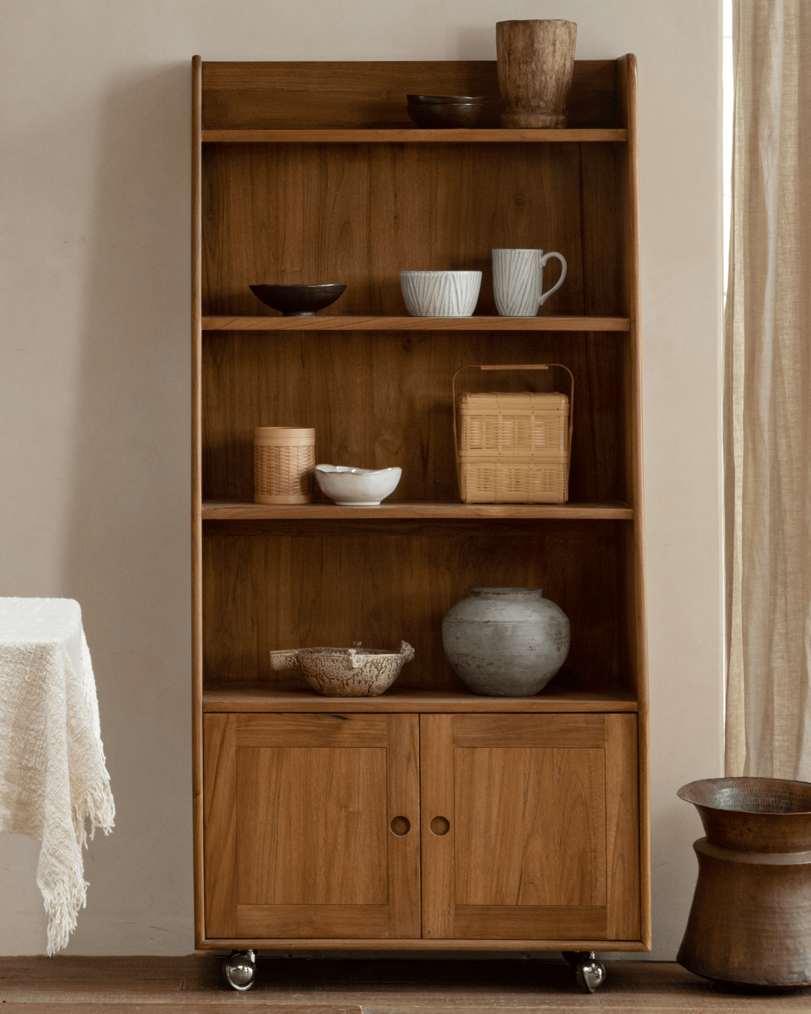 Lidi Display Cabinet - Teak wood display cabinet with adjustable shelves and universal wheels.