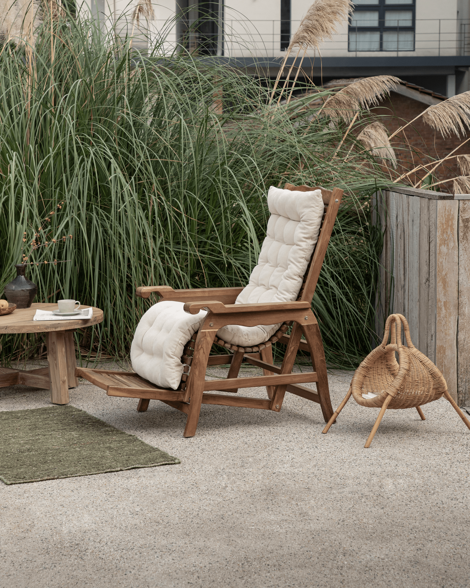 Teak Roller Chaise Lounge with cream cushions, perfect for outdoor relaxation and full-body support