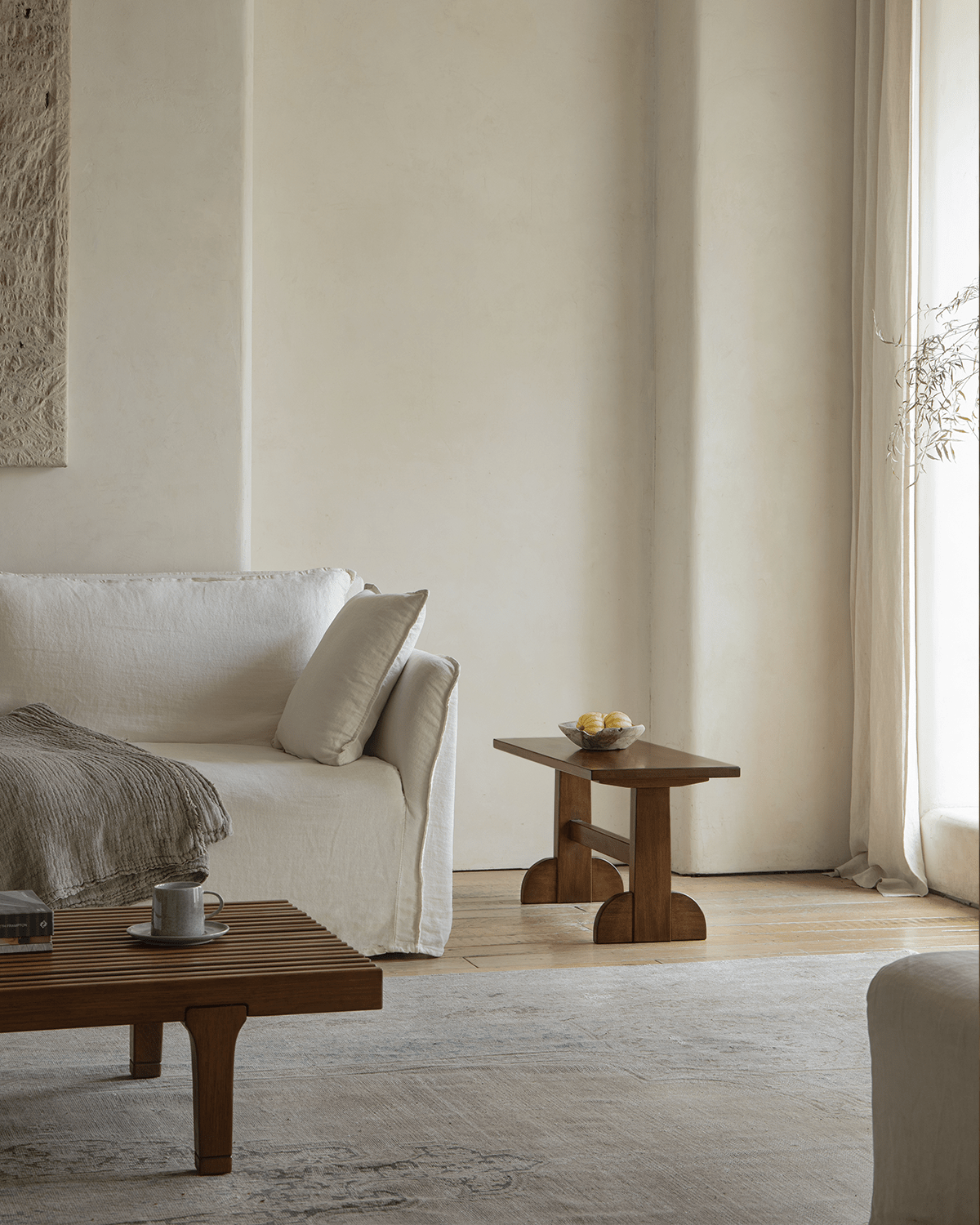 Hoof Side Table in retro living room setting, nanmu wood, with horseshoe-inspired design, showcasing modern home decor.