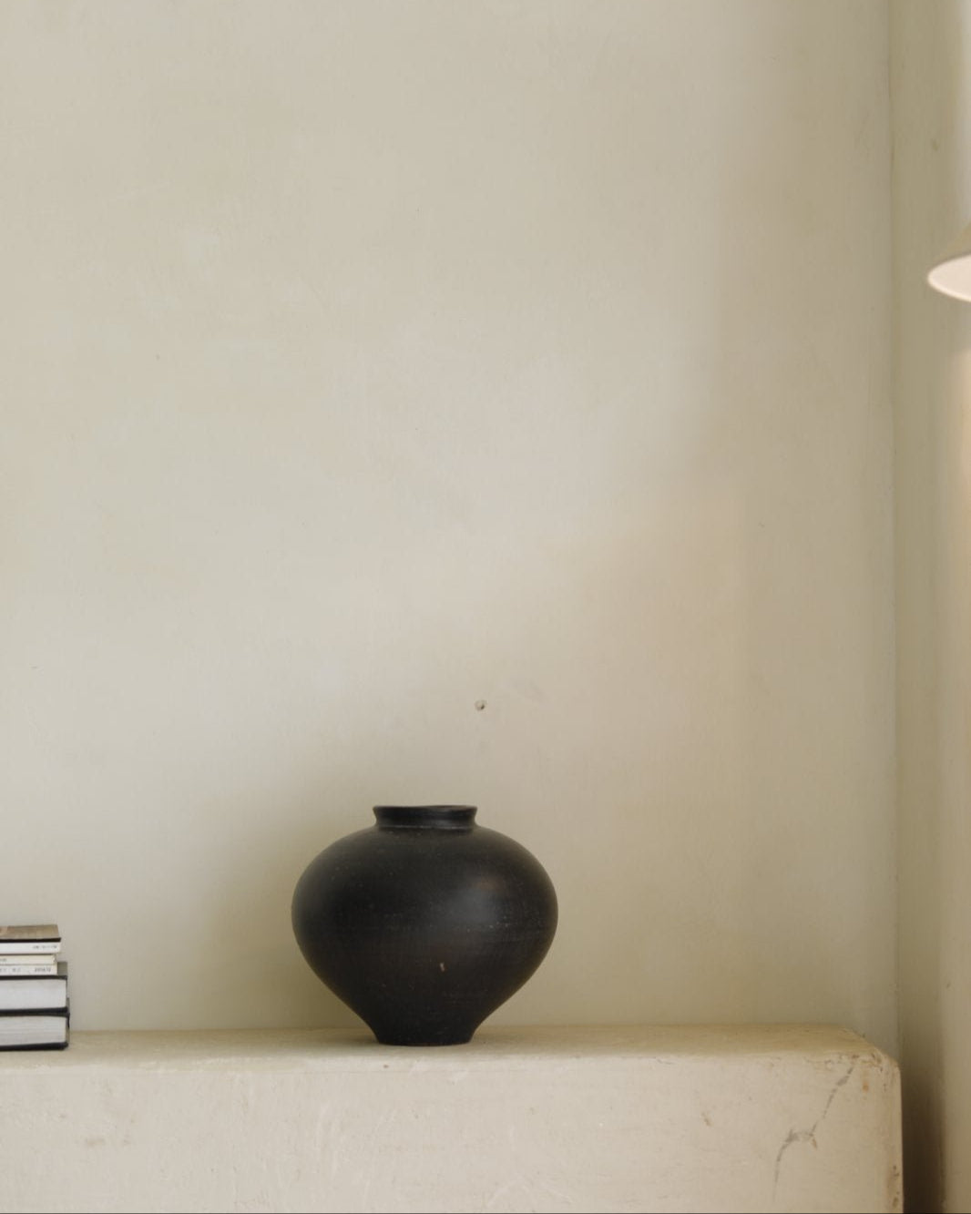 Black ceramic vase, spherical design, minimalist decor, perfect for home decor