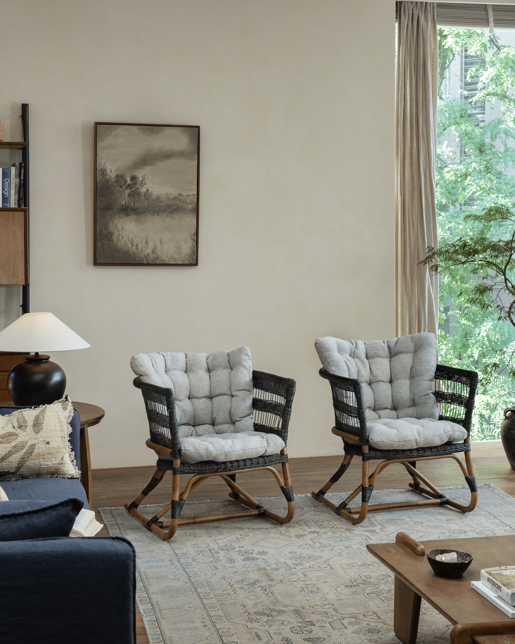 Helian Rattan Chairs in a cozy interior setting, with natural rattan frame and gray cushions, stylish design.