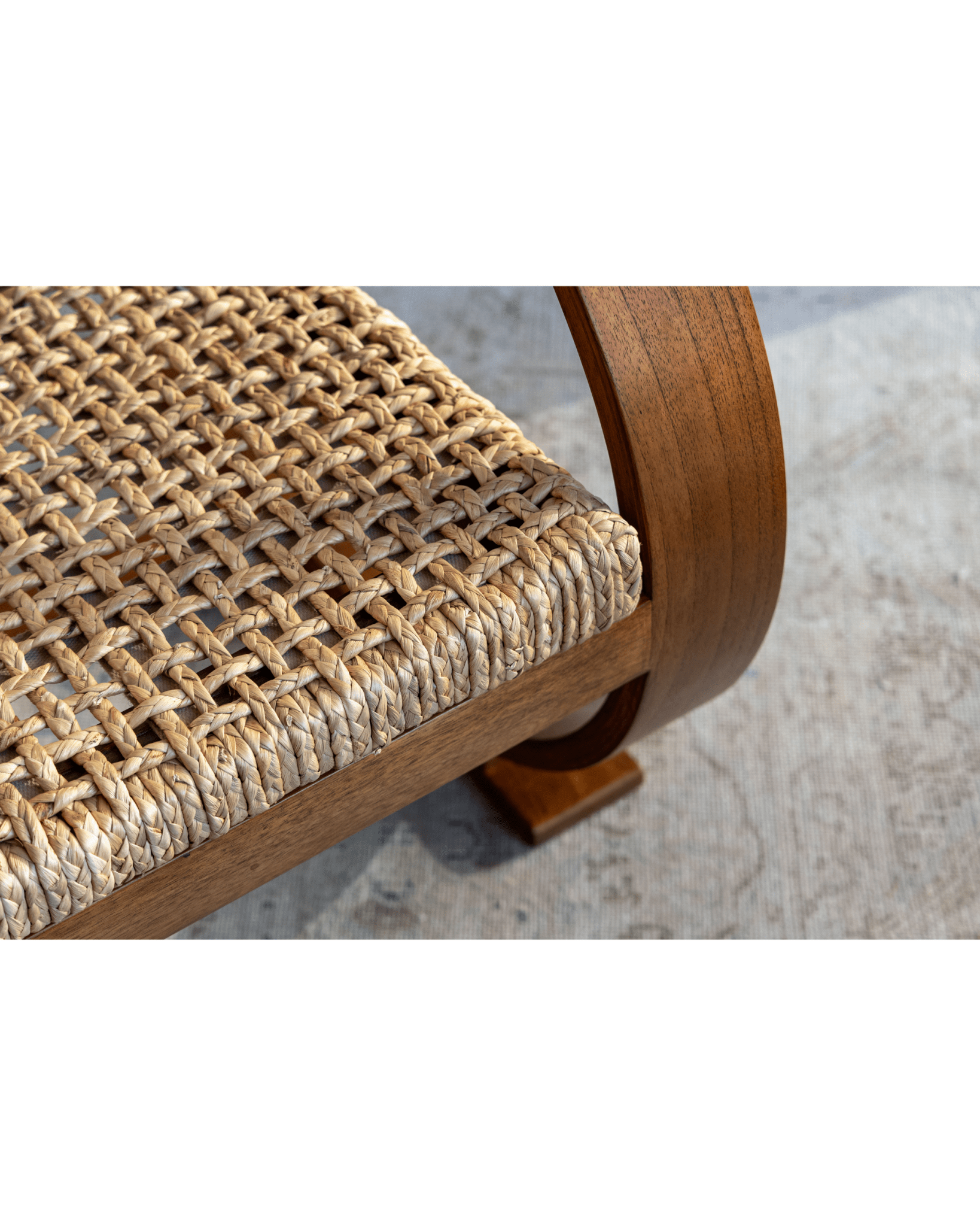 C Curve Lounge Chair detail: woven grass rope seat and bentwood frame, mid-century modern design.