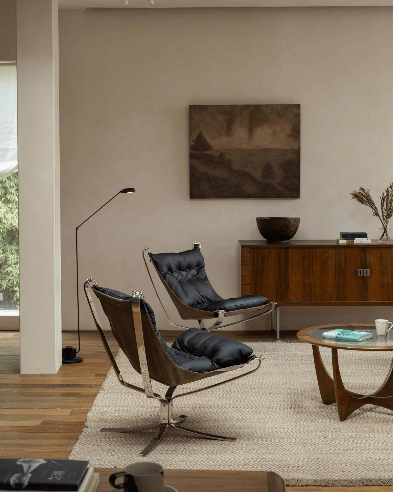 Scandinavian black leather Falcon chair with stainless steel frame, elegant interior design