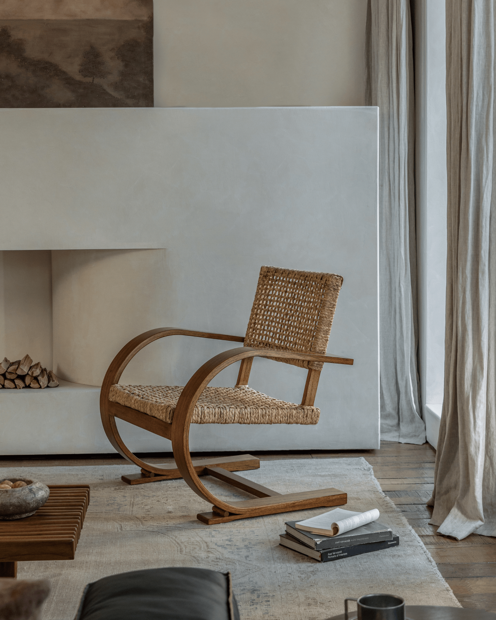 C Curve Lounge Chair with bentwood frame and woven grass rope seat in mid-century modern living room, elegant interior design
