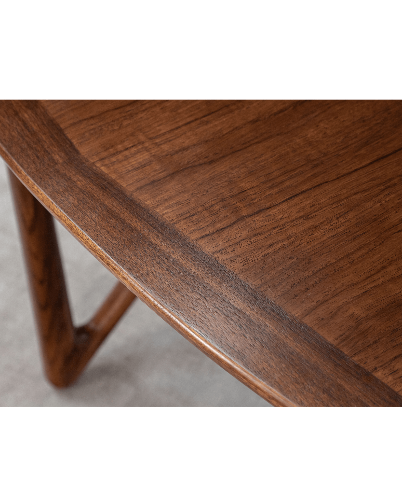 Niels Folding Table detail, Burmese teak wood, showing the table's edge and V-shaped leg