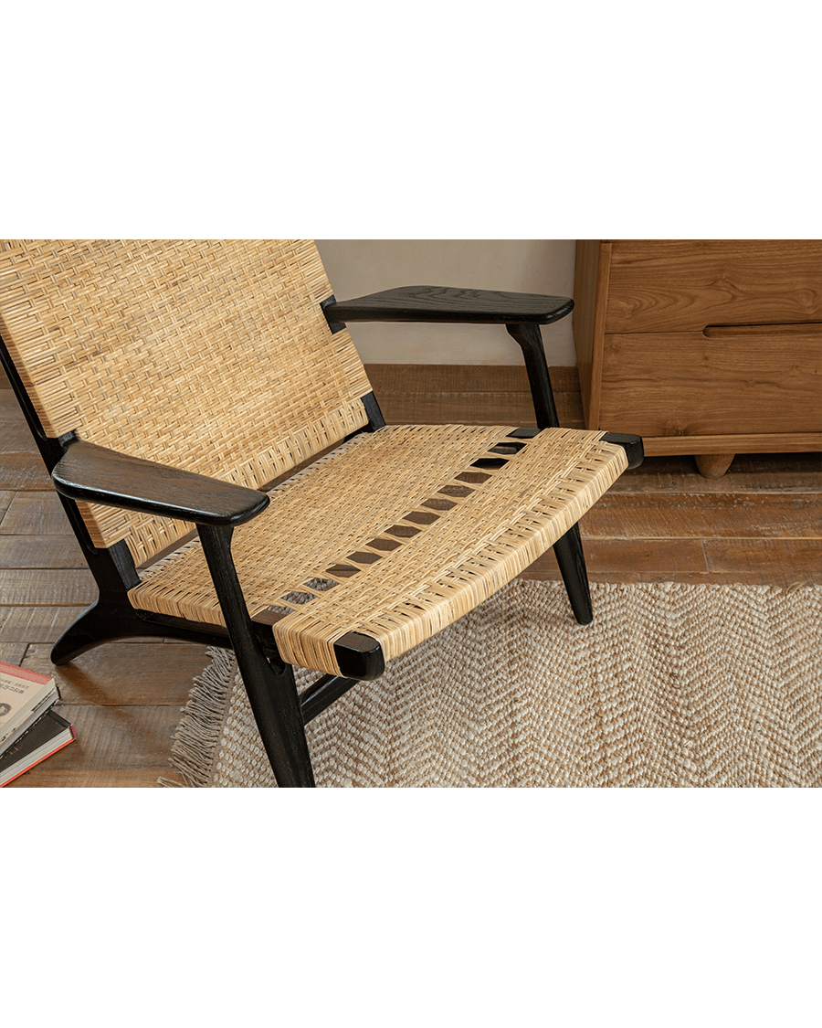 Horn Lounge Chair in black oak and natural rattan, ergonomic design, handcrafted for comfort and interior decor.