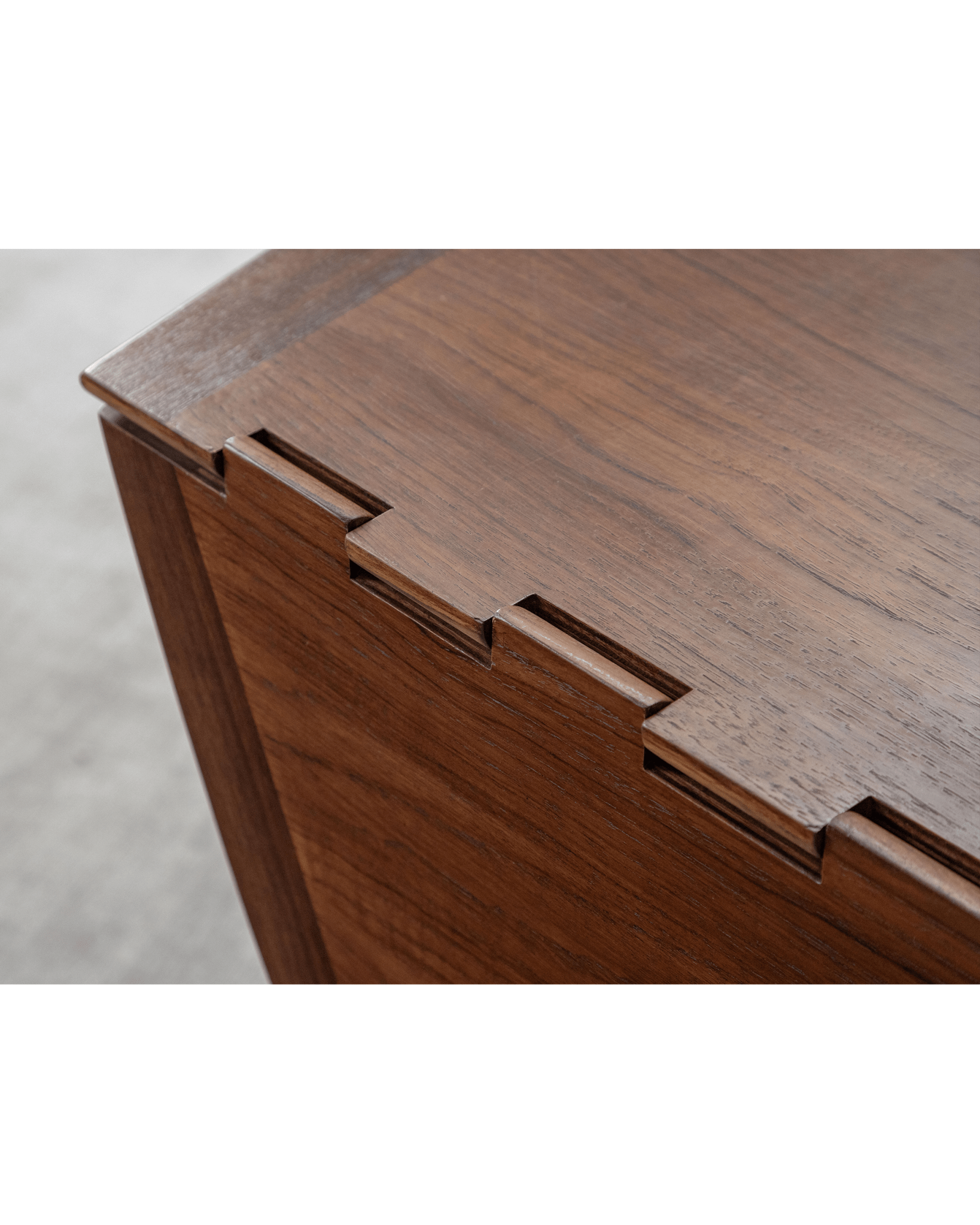 Niels Folding Table close-up, Burmese teak wood corner detail, mid-century design, showcasing joinery.