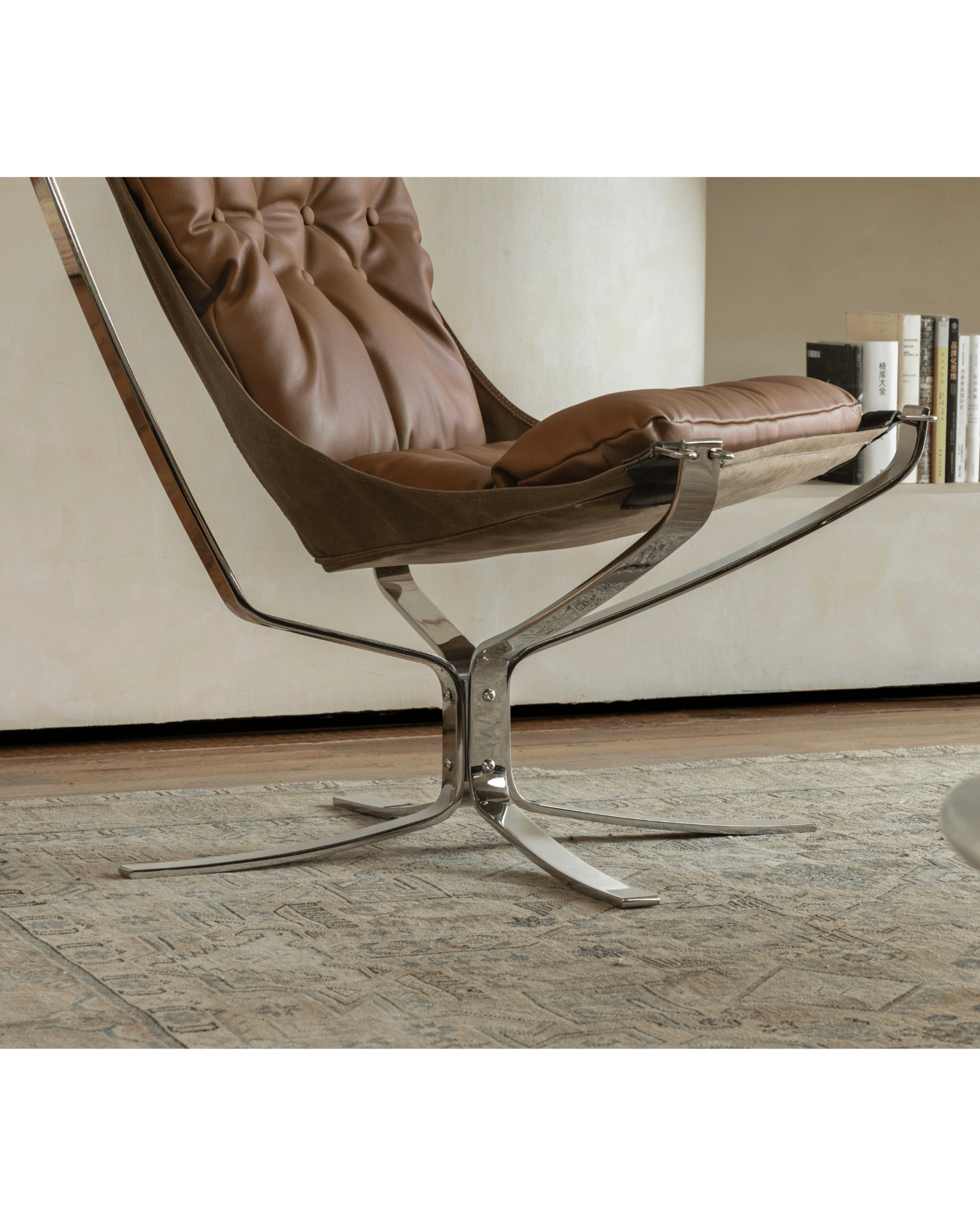 Brown leather Falcon Chair with stainless steel frame, Scandinavian design, premium comfort