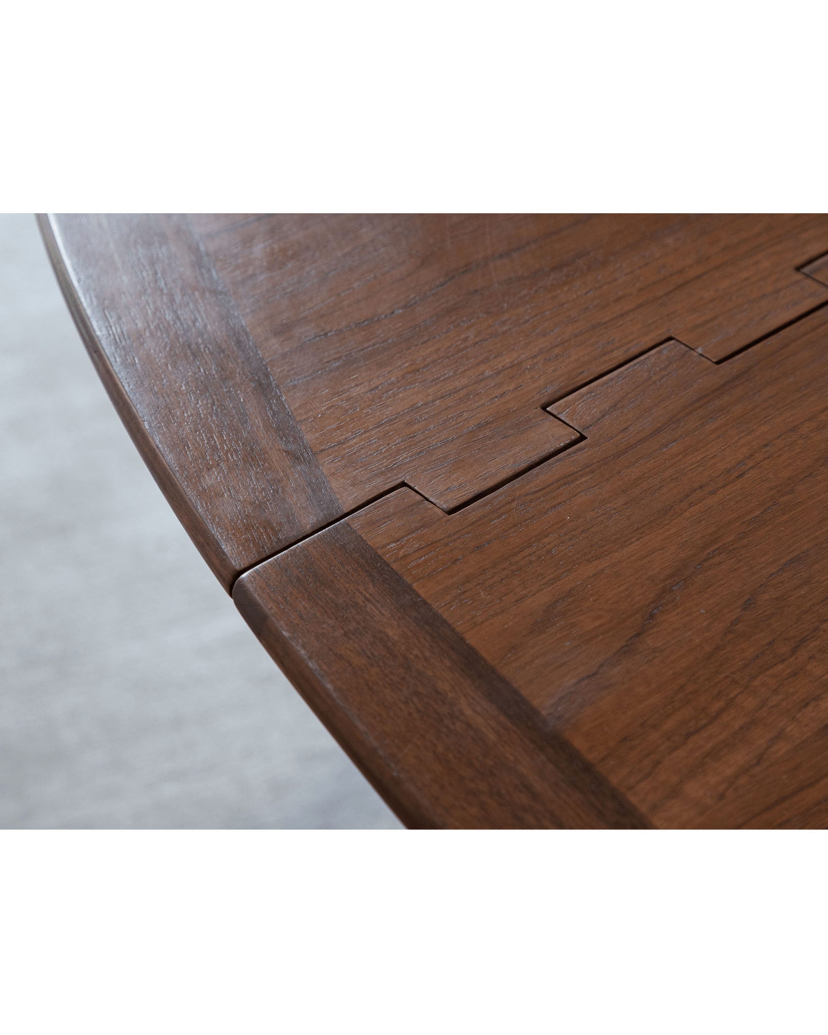 Niels Folding Table corner detail, Burmese teak wood, showcasing joinery and wood grain.