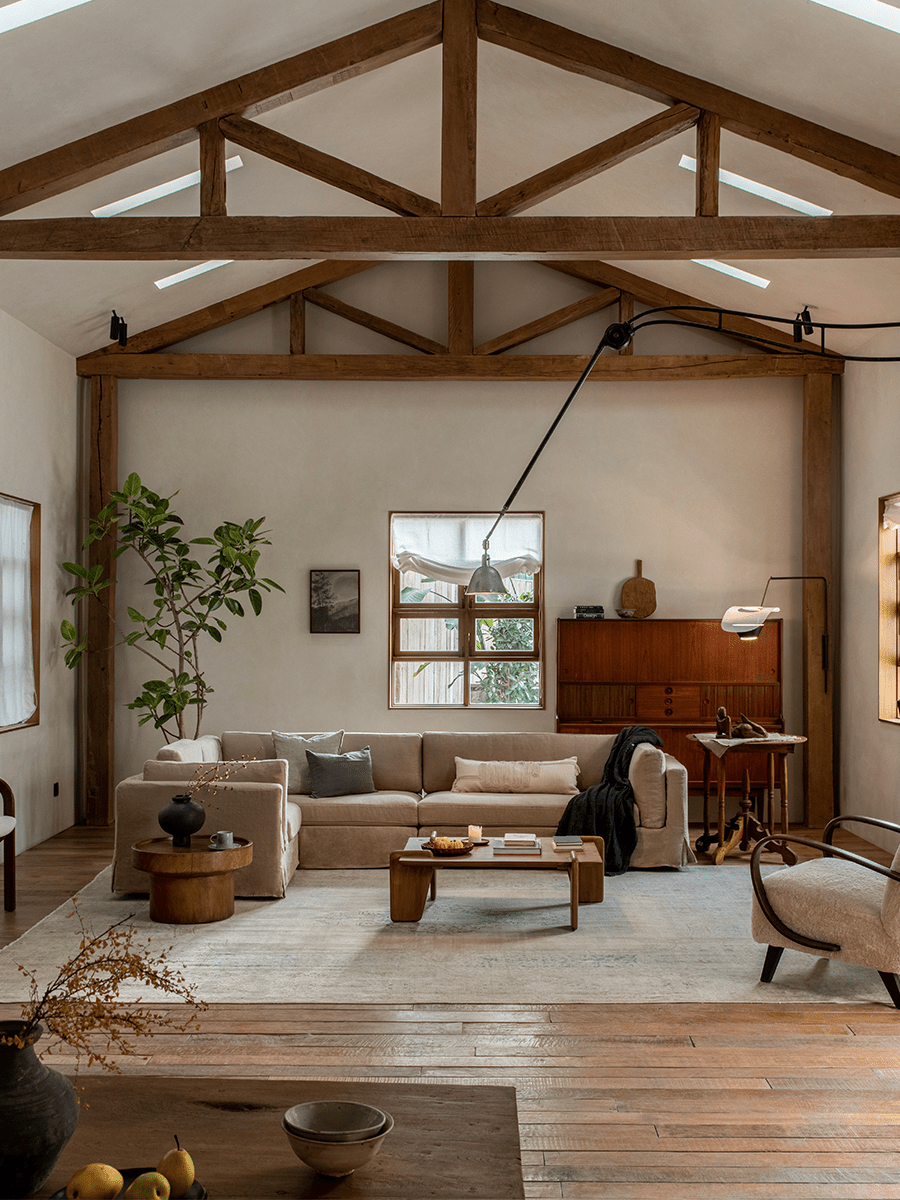 Beige linen skirt sectional sofa in a modern living room, modular design, and relaxed atmosphere