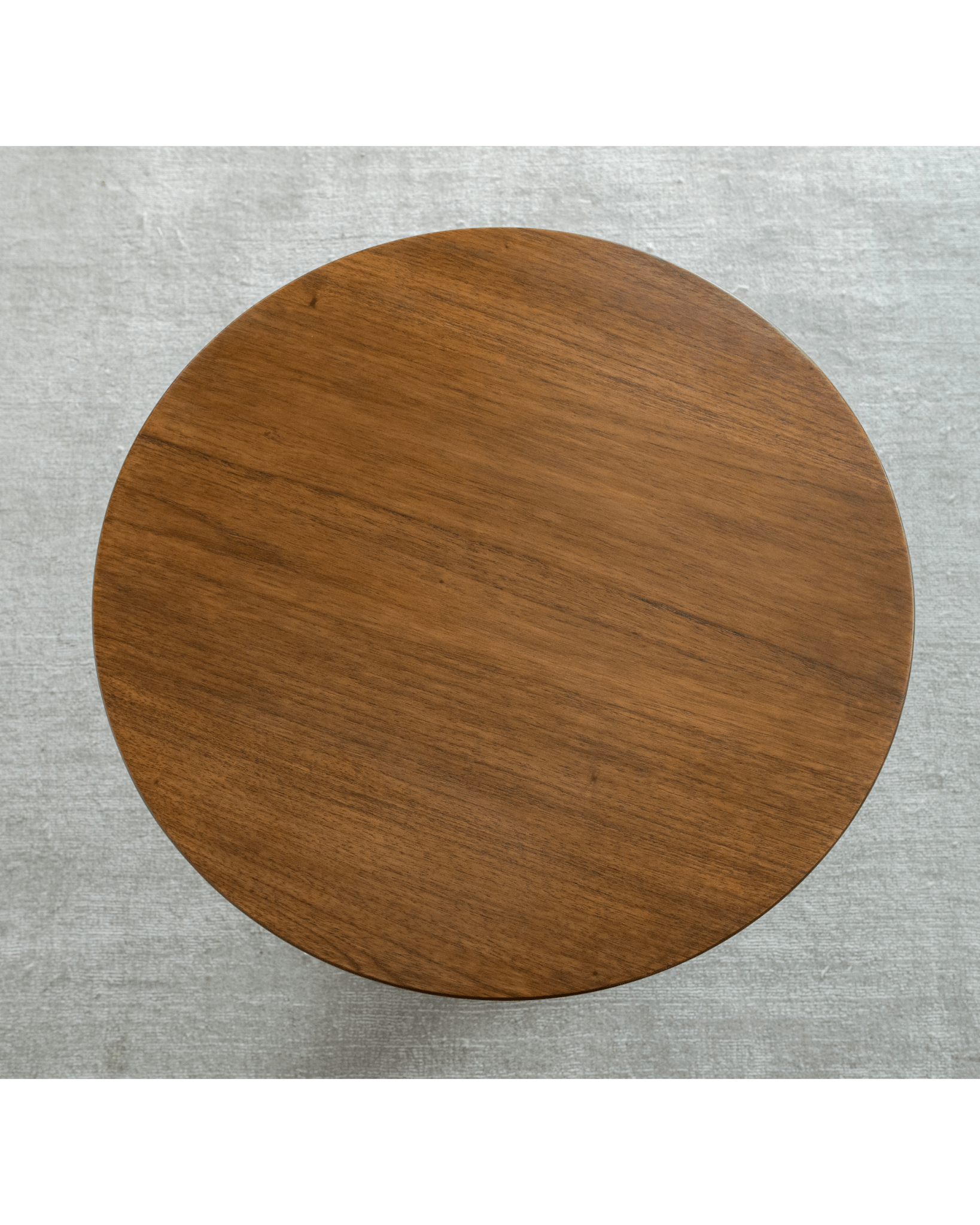 Close-up view of solid teak Spindle Side Table tabletop, showing wood grain details.