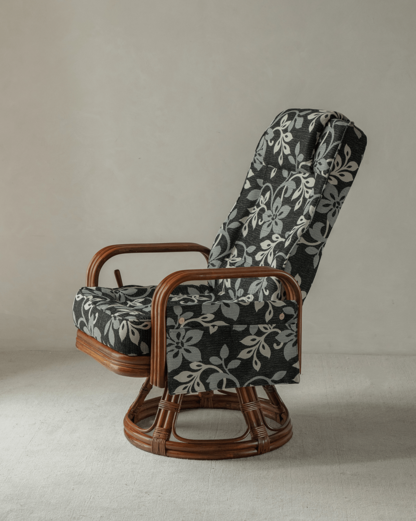 Willow Rattan Chair with floral cushions, Indonesian rattan frame, and modern design