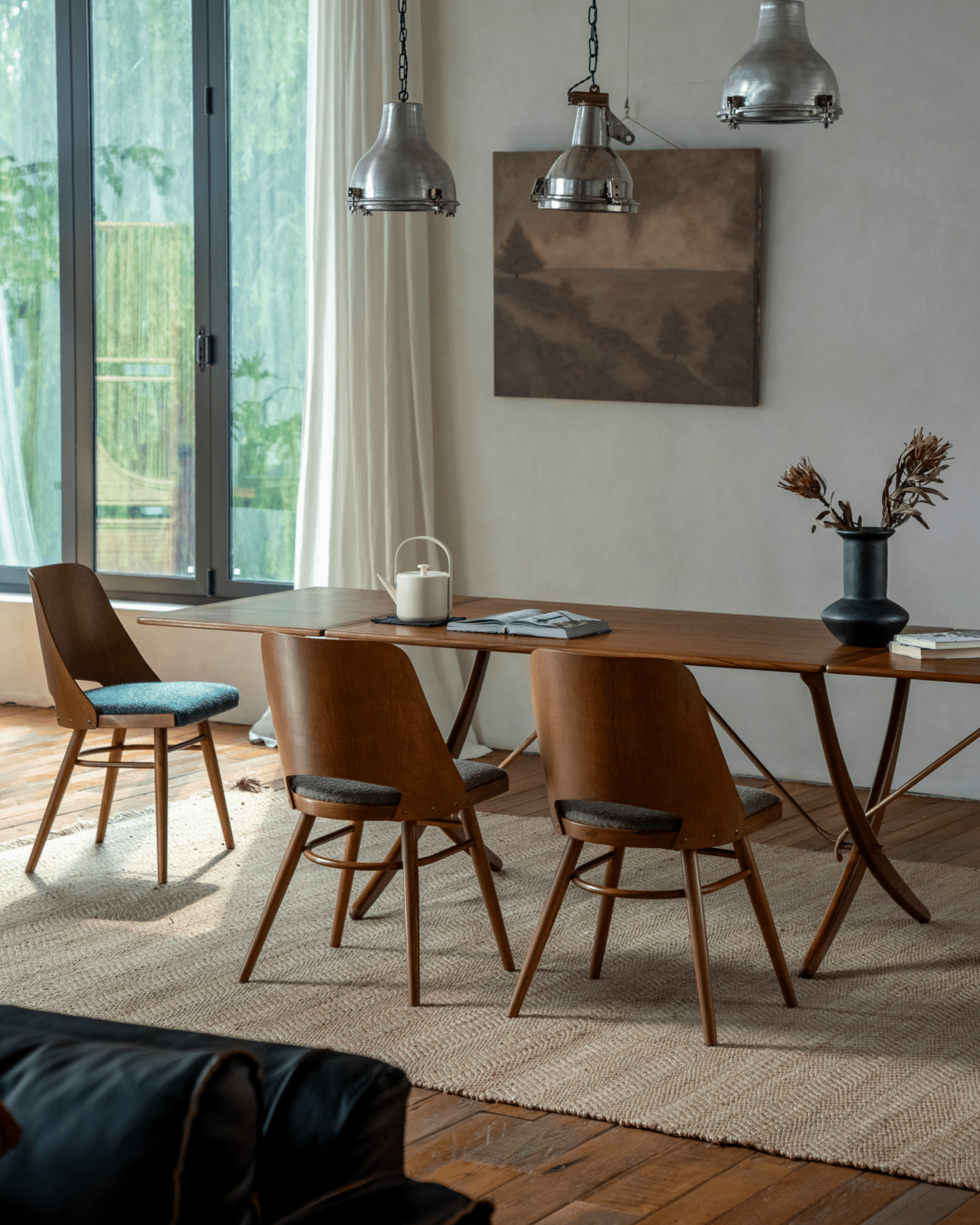 Shell Chair dining set: Teak wood chairs with loop fabric seats, mid-century modern design, indoors.