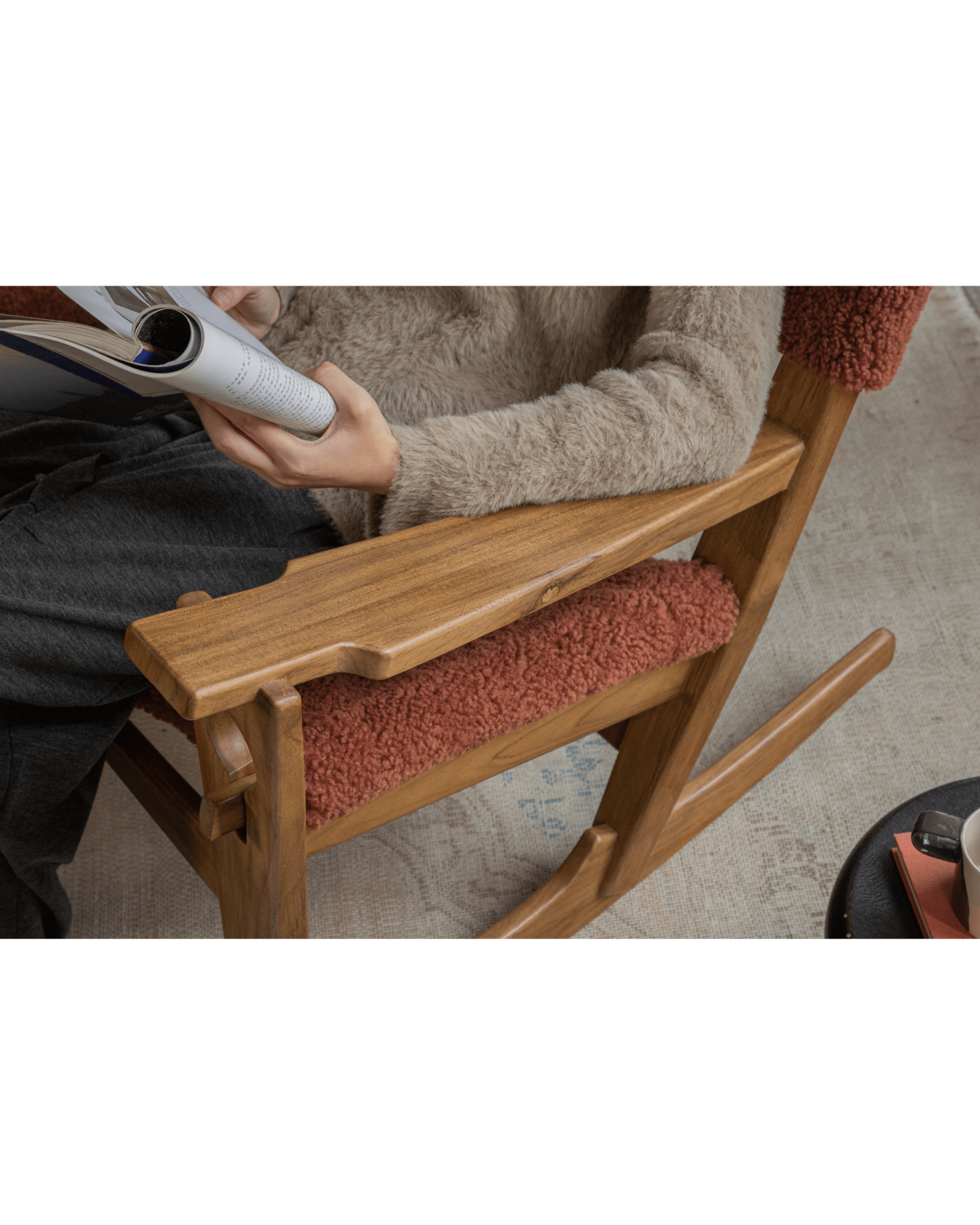 Hans Rocking Chair: Teak frame, plush wine red shearling upholstery, Danish design.