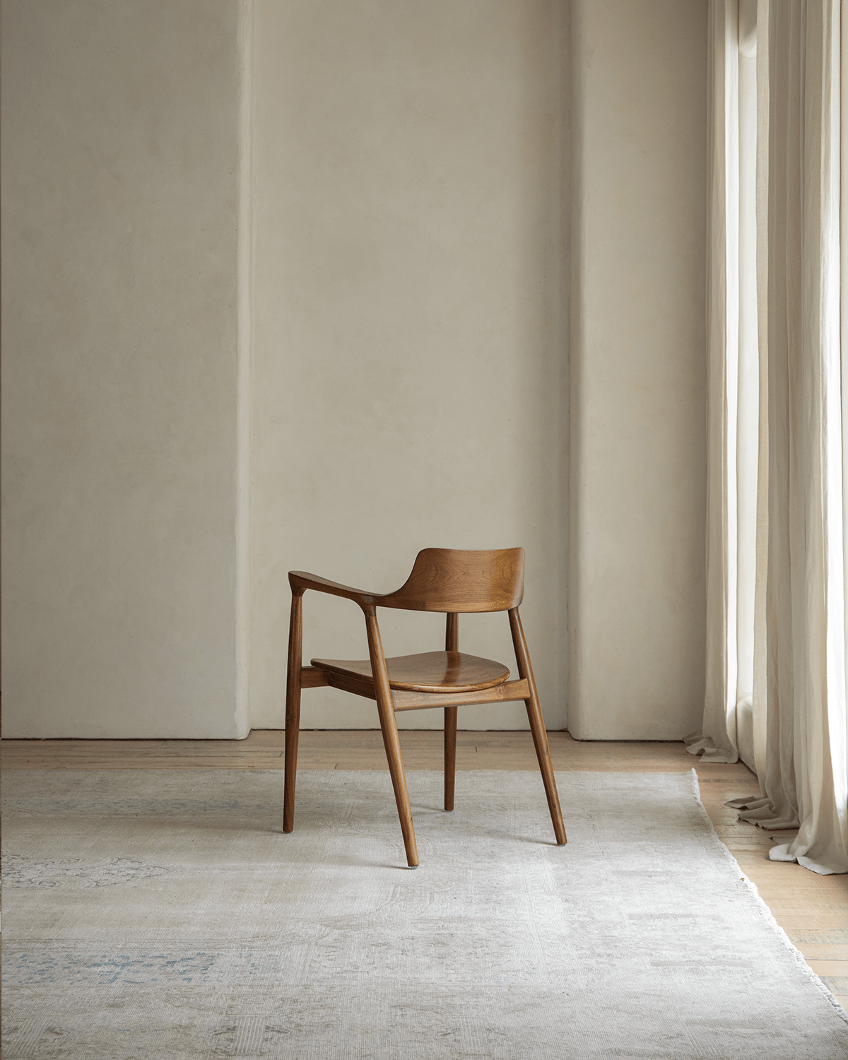 Hiroshima Chair - Solid wood armchair with curved design, perfect for modern living spaces.