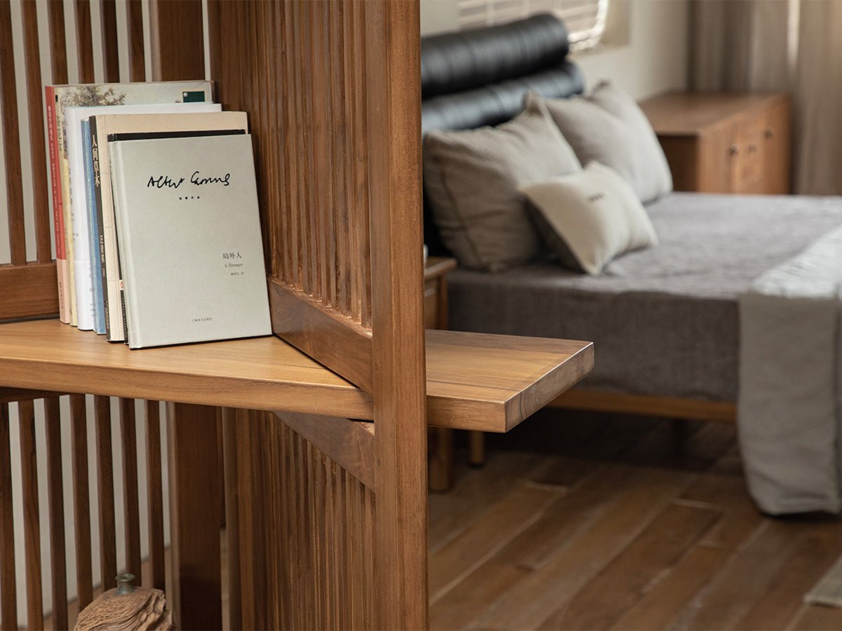 Sylvan Room Divider made of teak wood with books on shelf, bedroom setting.