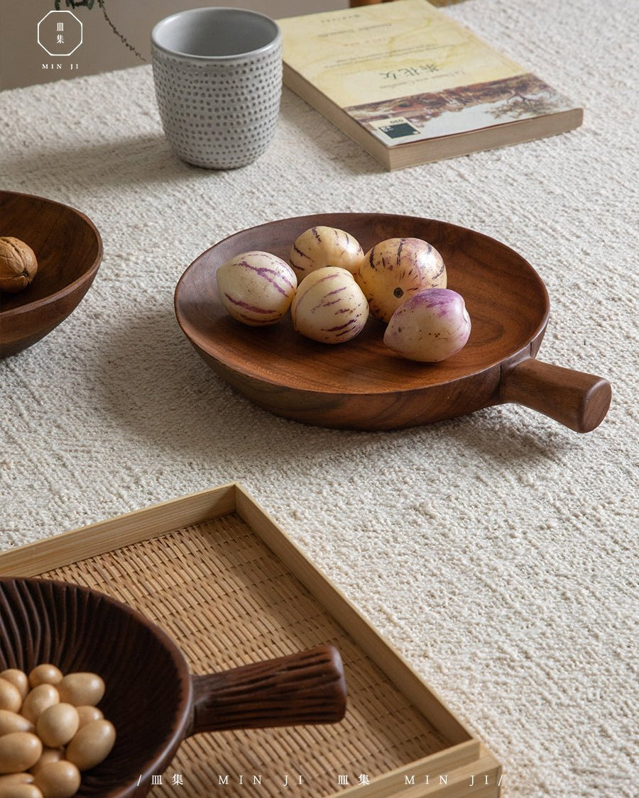 Fany Tray, handcrafted teak wood serving tray with handle, displaying striped fruits.