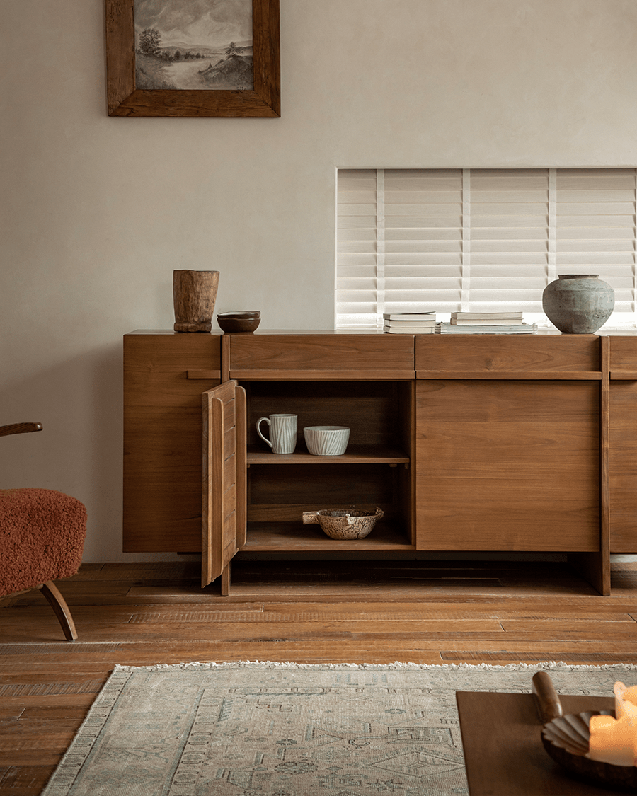 NO.42 Teak Sideboard in a living room setting. Solid teak wood buffet-style with open door