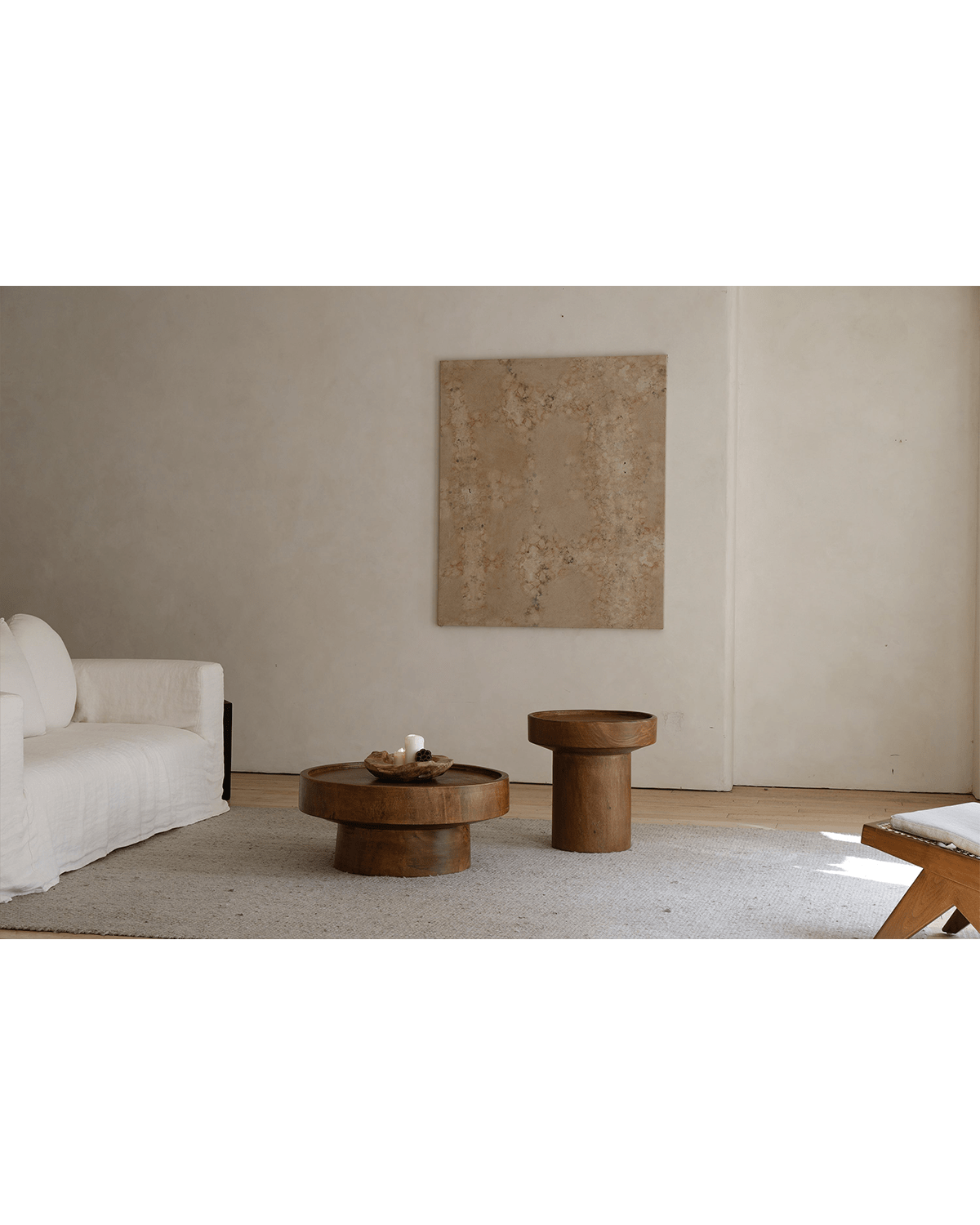 Stamp Coffee Table in warm wood finish, sculptural design, modern living room with complementary decor