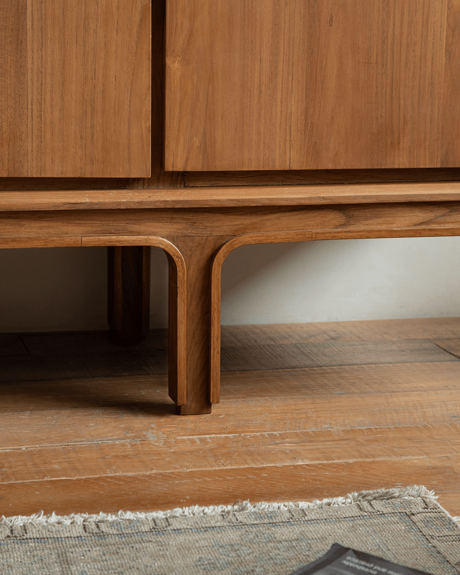 NO.44 Teak Sideboard showcasing leg and door details. Solid teak wood buffet with elegant design for modern interiors.