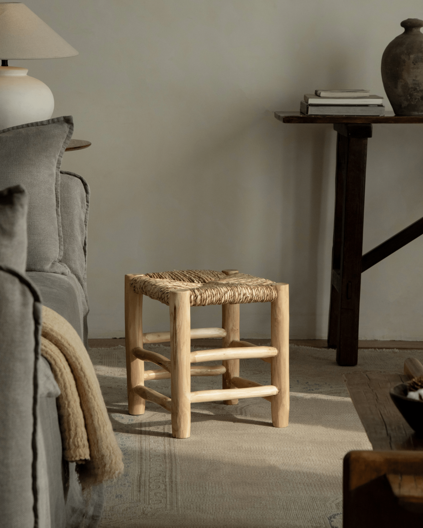 Isla Handwoven Stool with natural wood frame and woven pandan seat, perfect for a modern and organic space.