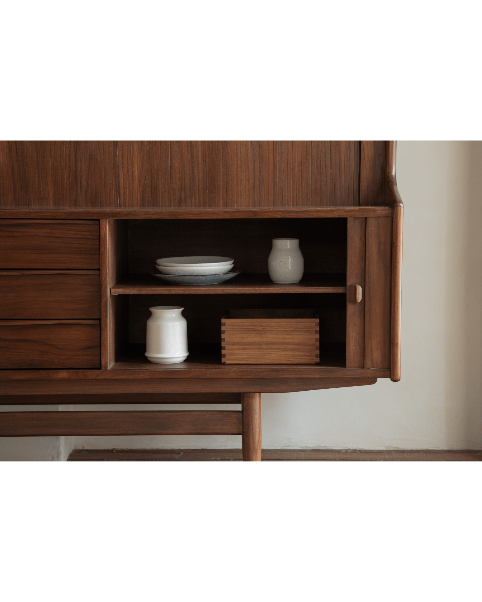 Ibu Teak Sideboard showcasing interior shelf with plates and vases, teak wood design, Scandinavian style