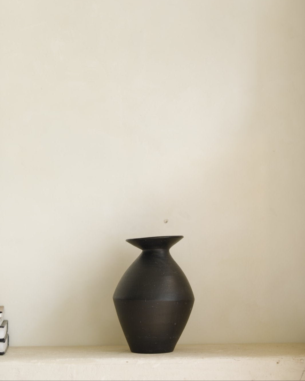 Black ceramic vase for home decor, modern and minimalist design