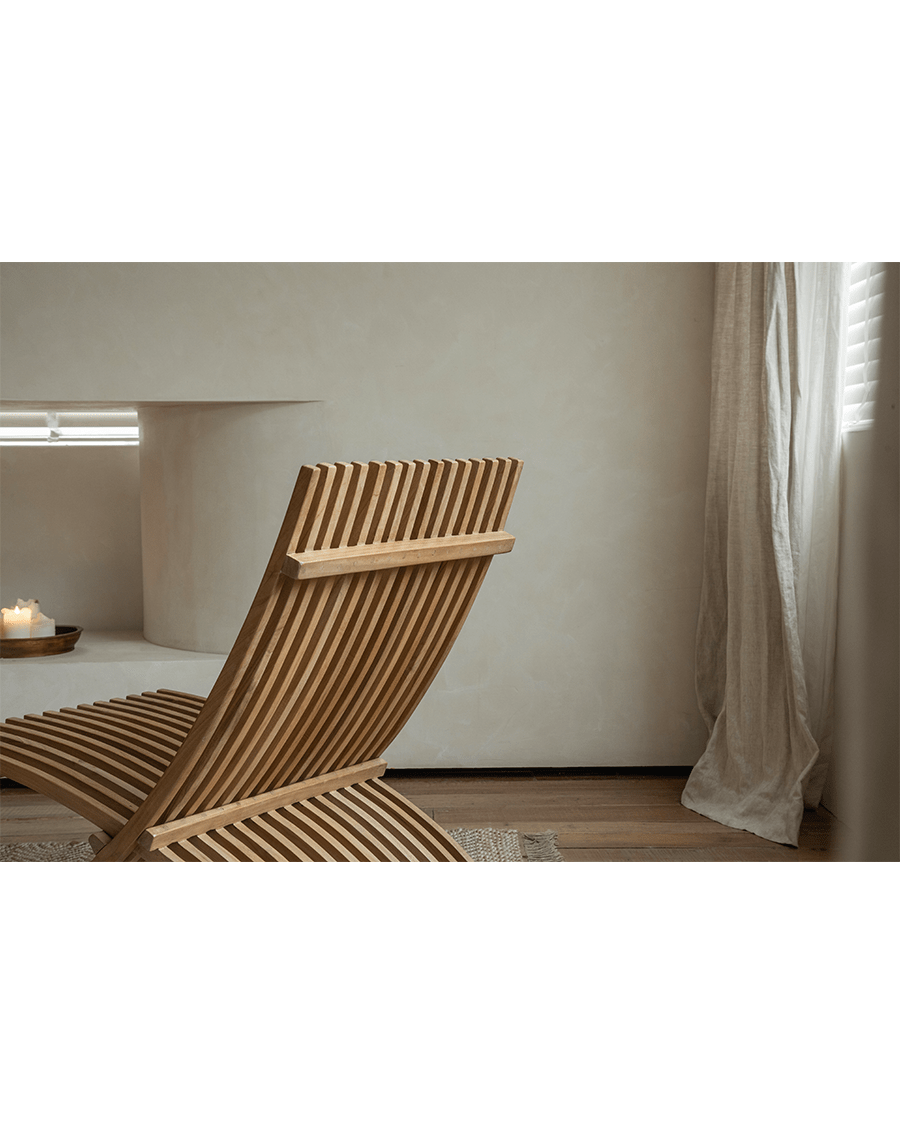 Oly Lounge Chair: Wooden slatted design for indoor relaxation, ergonomic and stylish seating.
