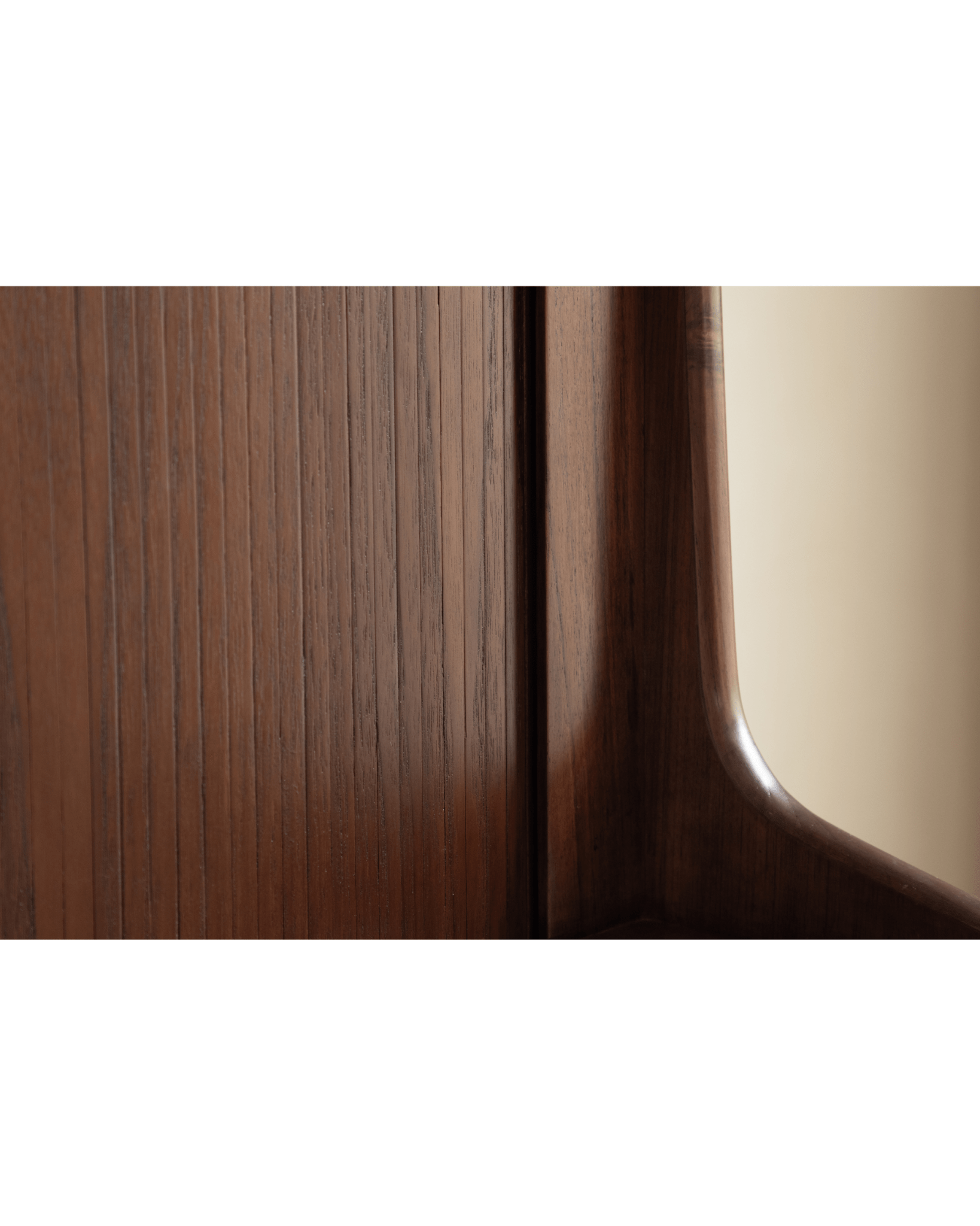 Ibu Teak Sideboard close-up showcasing rich teak wood grain texture and smooth curved edge.