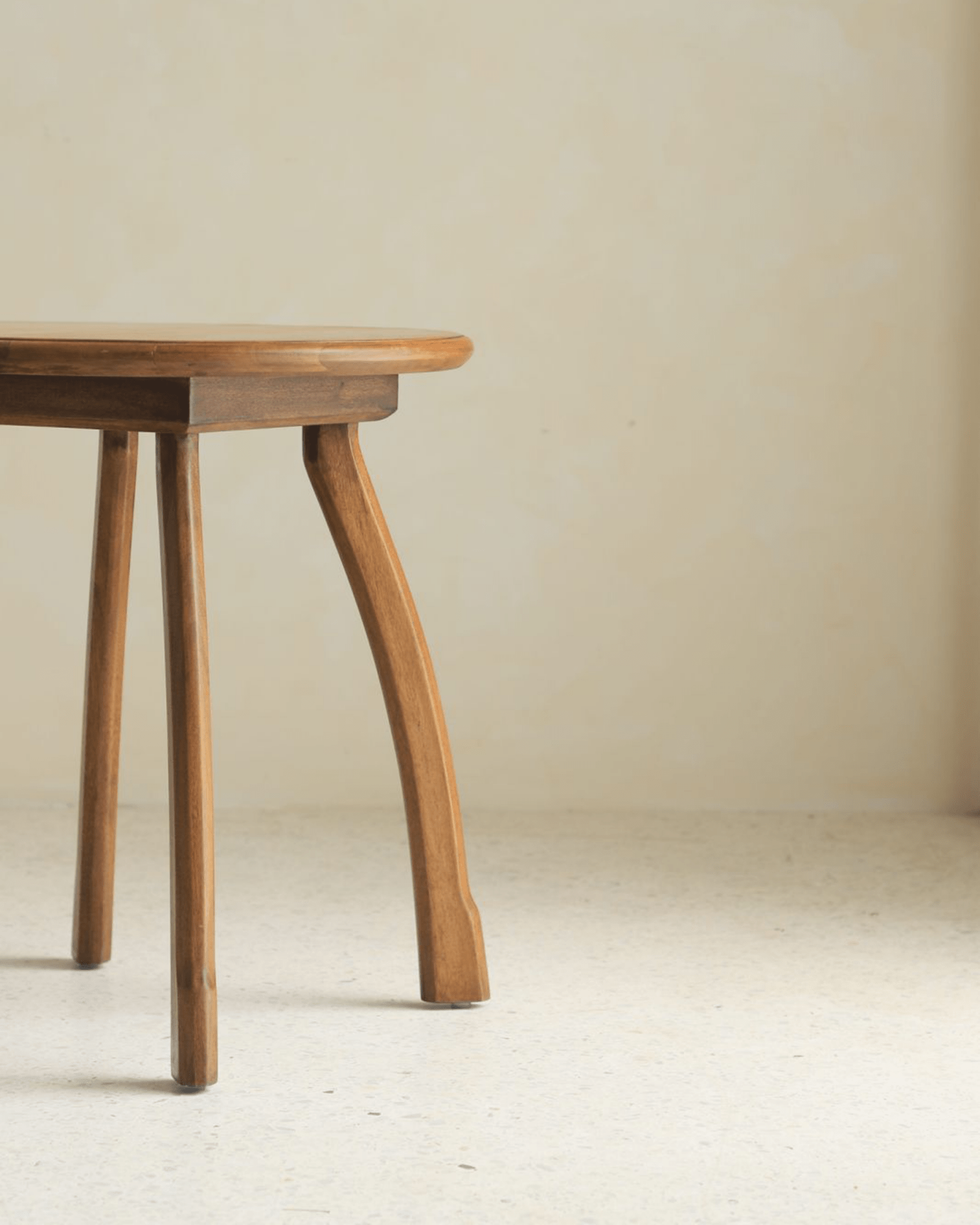 Ele Round Side Table showcasing the unique octopus-inspired leg design and vintage Phoebe wood finish.