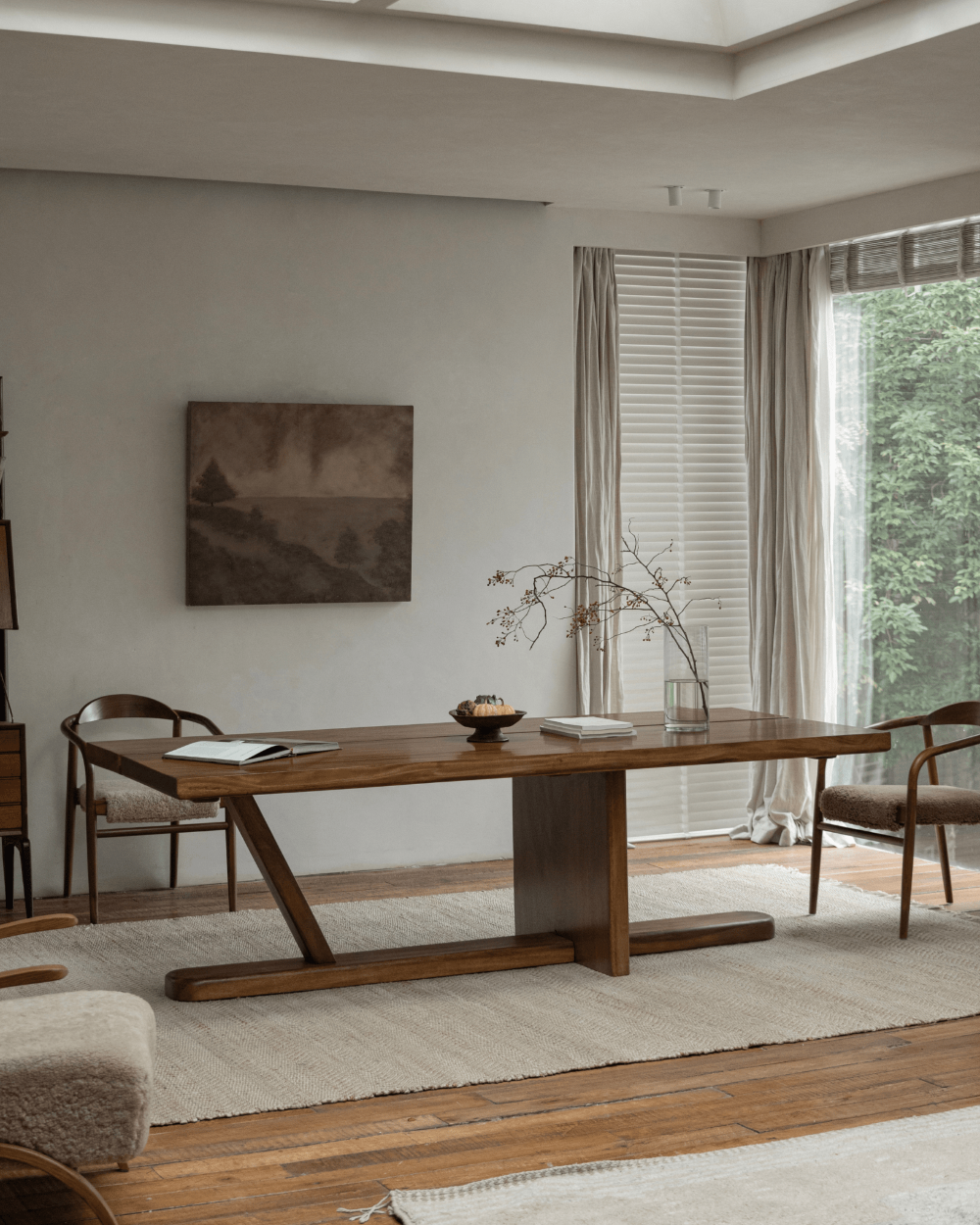 Sailboat desk in a modern setting, solid wood with Z-shaped leg, natural light, and elegant decor