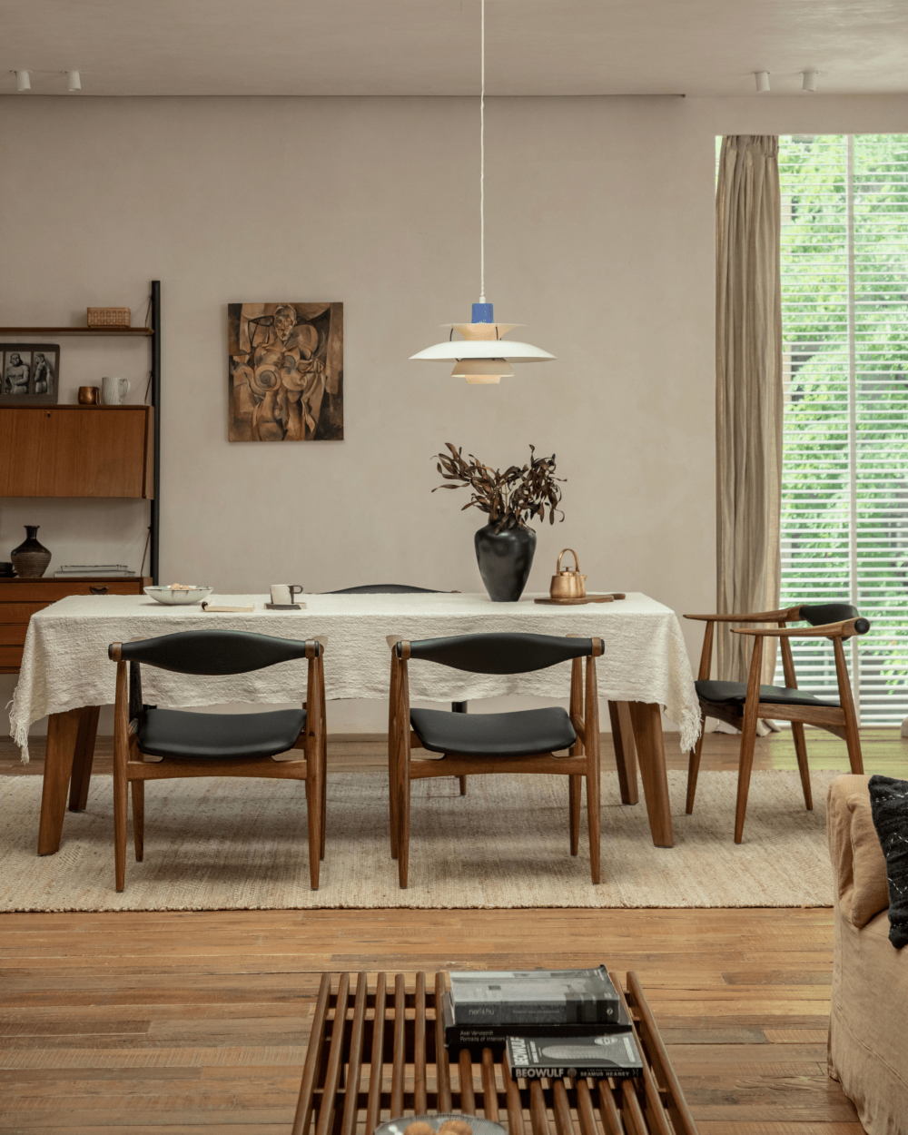 CH34 Yoke Chair in ebony wood with black leather upholstery, mid-century modern dining room design