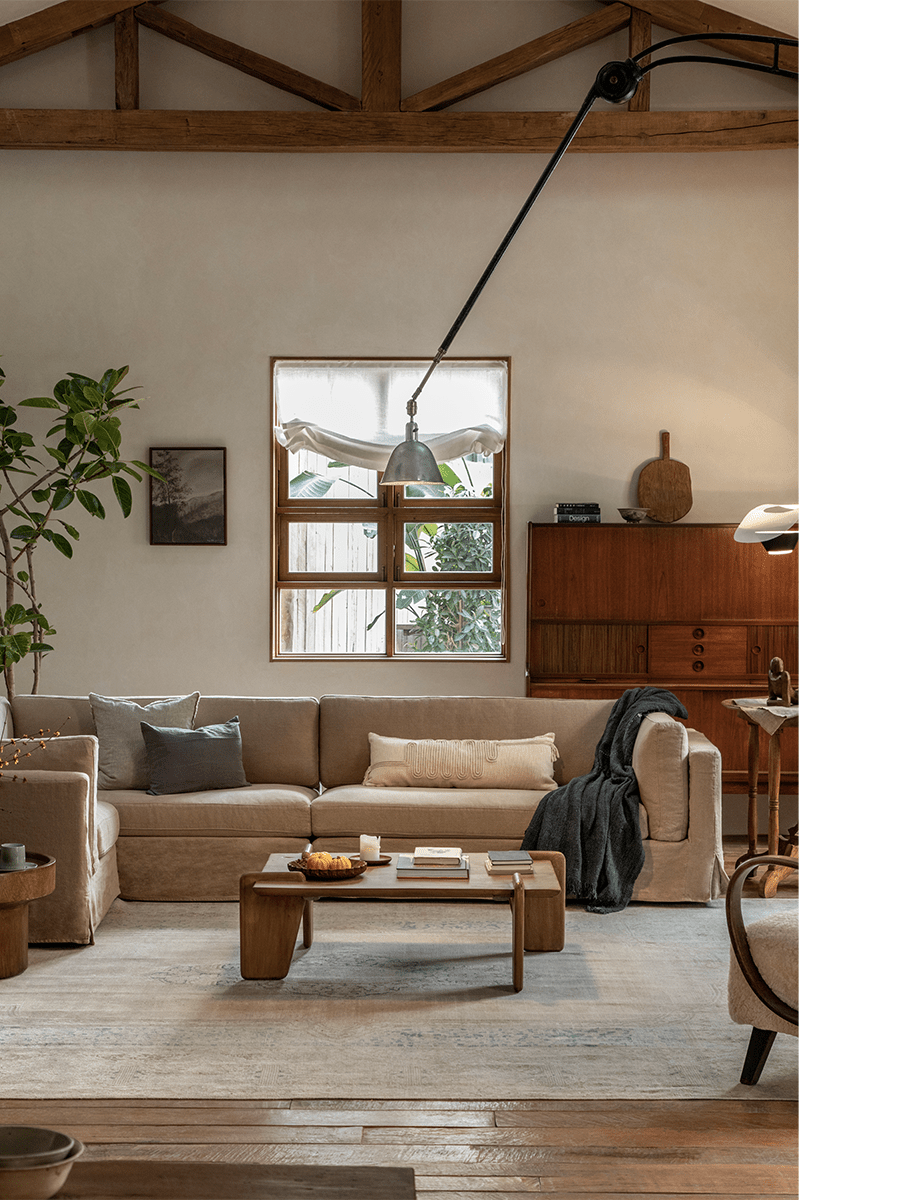 Beige linen Skirt Sectional Sofa in a modern living room with a relaxed, customizable design
