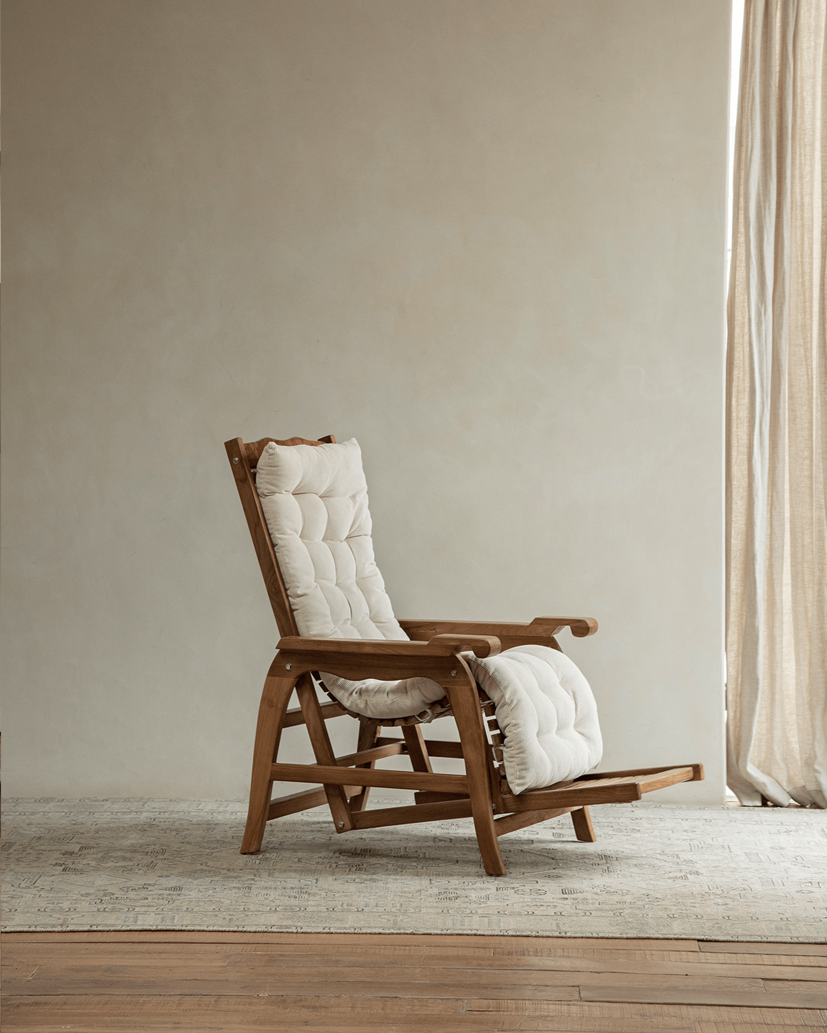 Roller Chaise Lounge Chair in Teak Wood with Cream Cushions for ultimate relaxation and comfort.