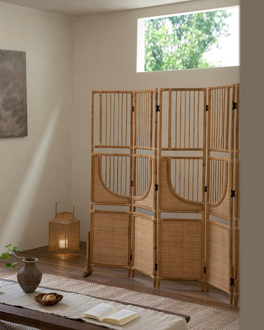 Sunlit Rattan Screen, a 4-panel natural rattan room divider with woven base and slatted top.