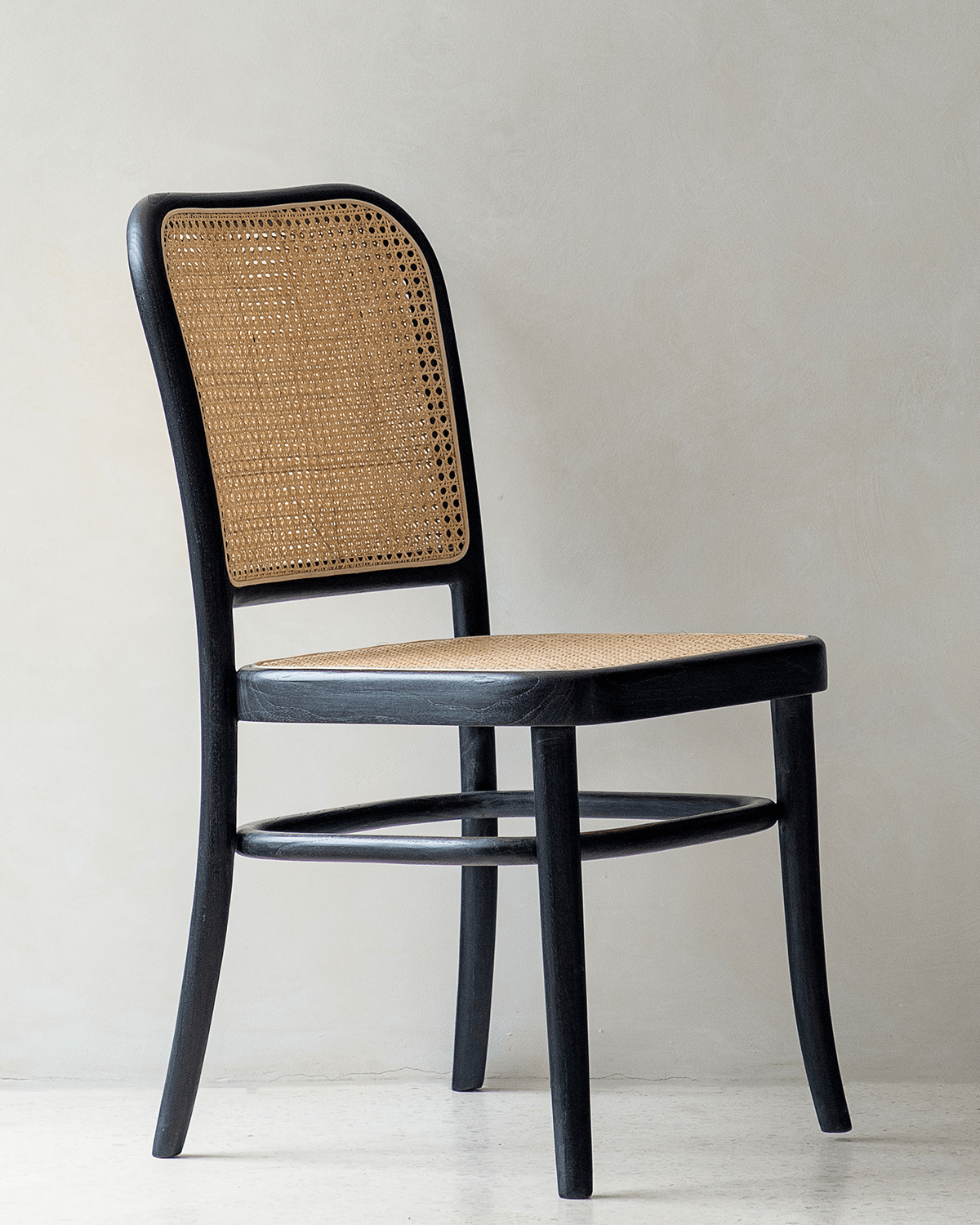 NO.811 Chair in black wood and natural rattan, mid-century design for versatile interior use