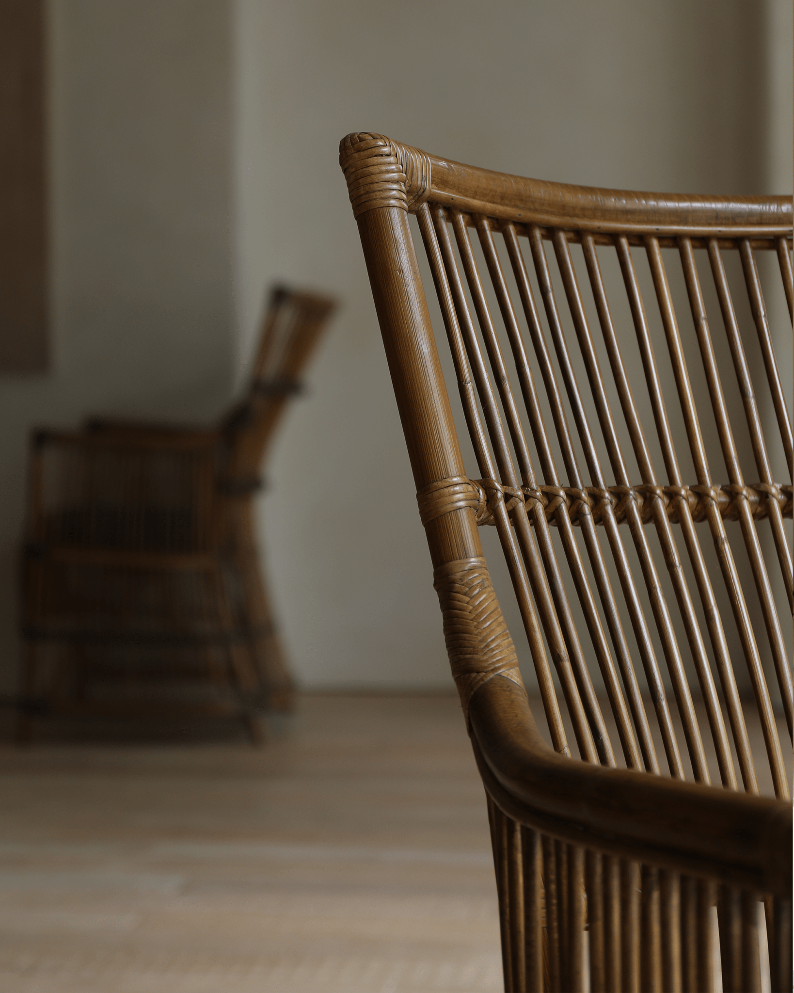 Da Vinci Chair detail: hand-woven rattan backrest and bamboo design.
