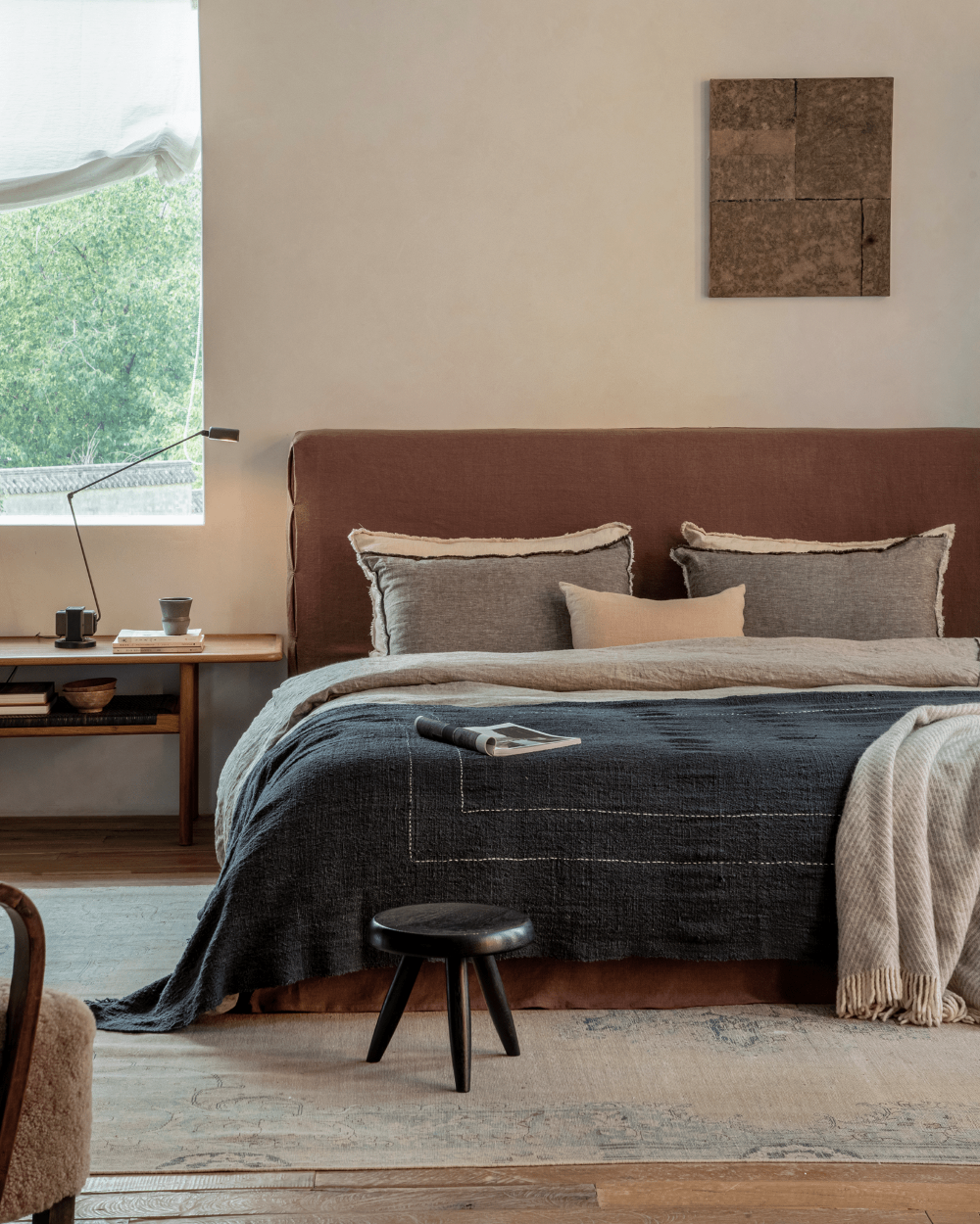 Freya Linen Bed in modern bedroom, terracotta linen headboard, dark blue blanket, peaceful sleep