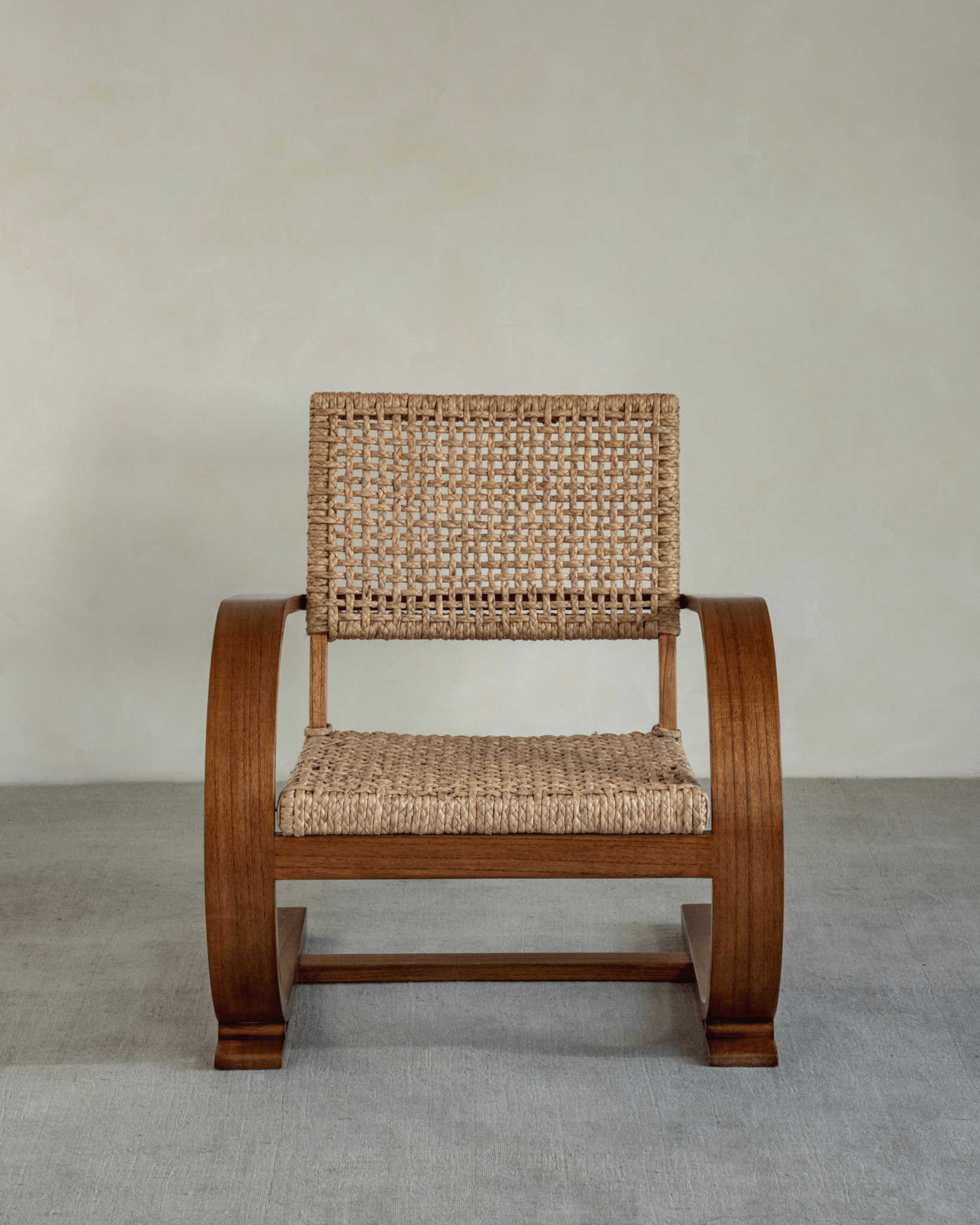 C Curve Lounge Chair with bentwood frame and woven grass rope seat. Mid-century modern design