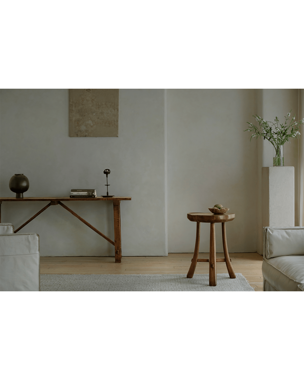 Basin Side Table in a modern living room setting, showcasing natural wood grain and minimalist design
