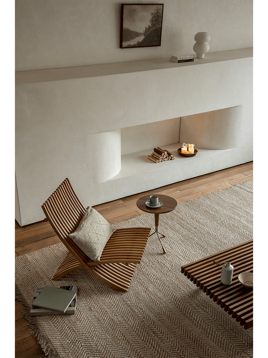 Oly Lounge Chair in modern living room setting, wooden slatted design, ergonomic and stylish seating.