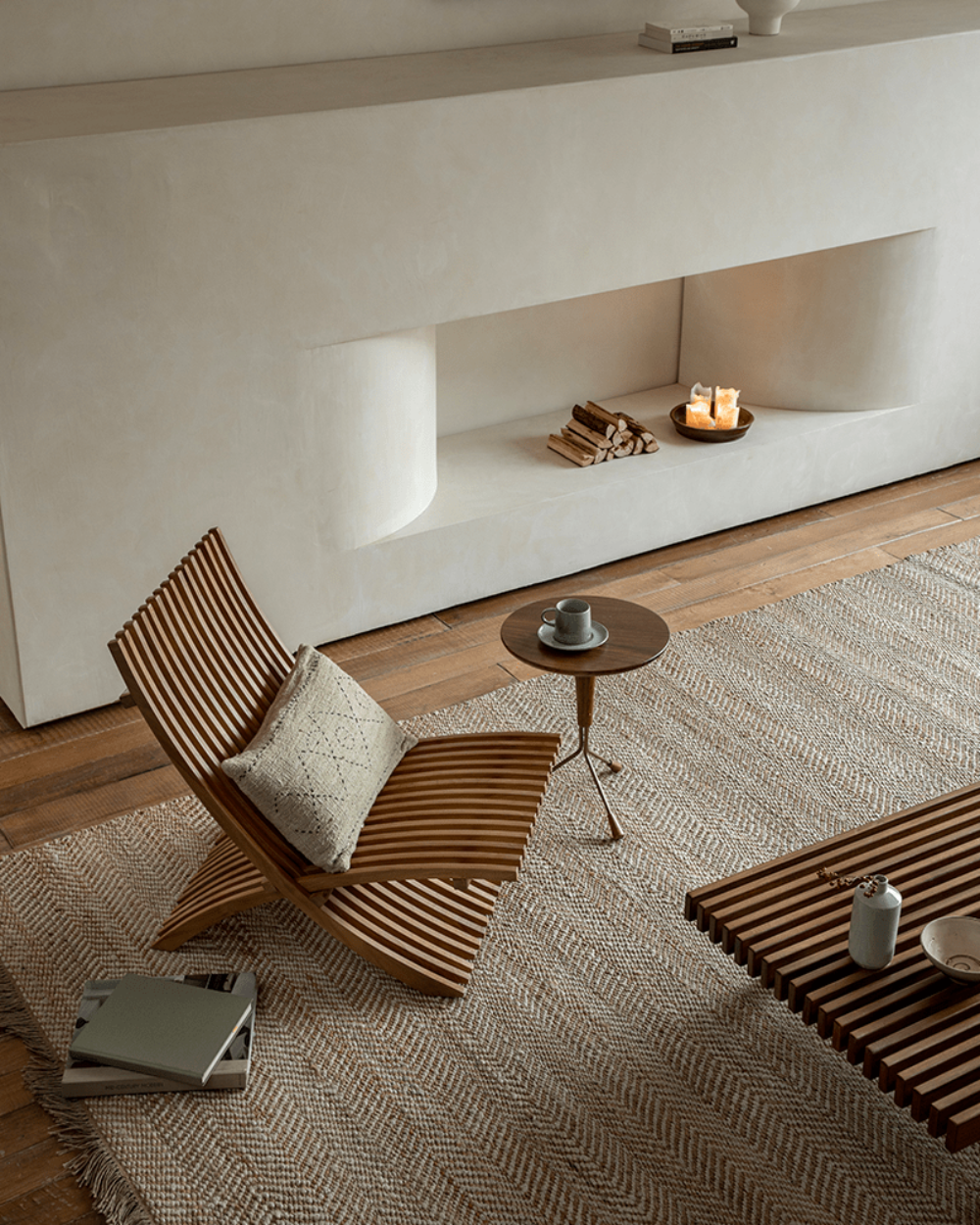 Oly Lounge Chair in modern living room setting, wooden slatted design, ergonomic and stylish seating.