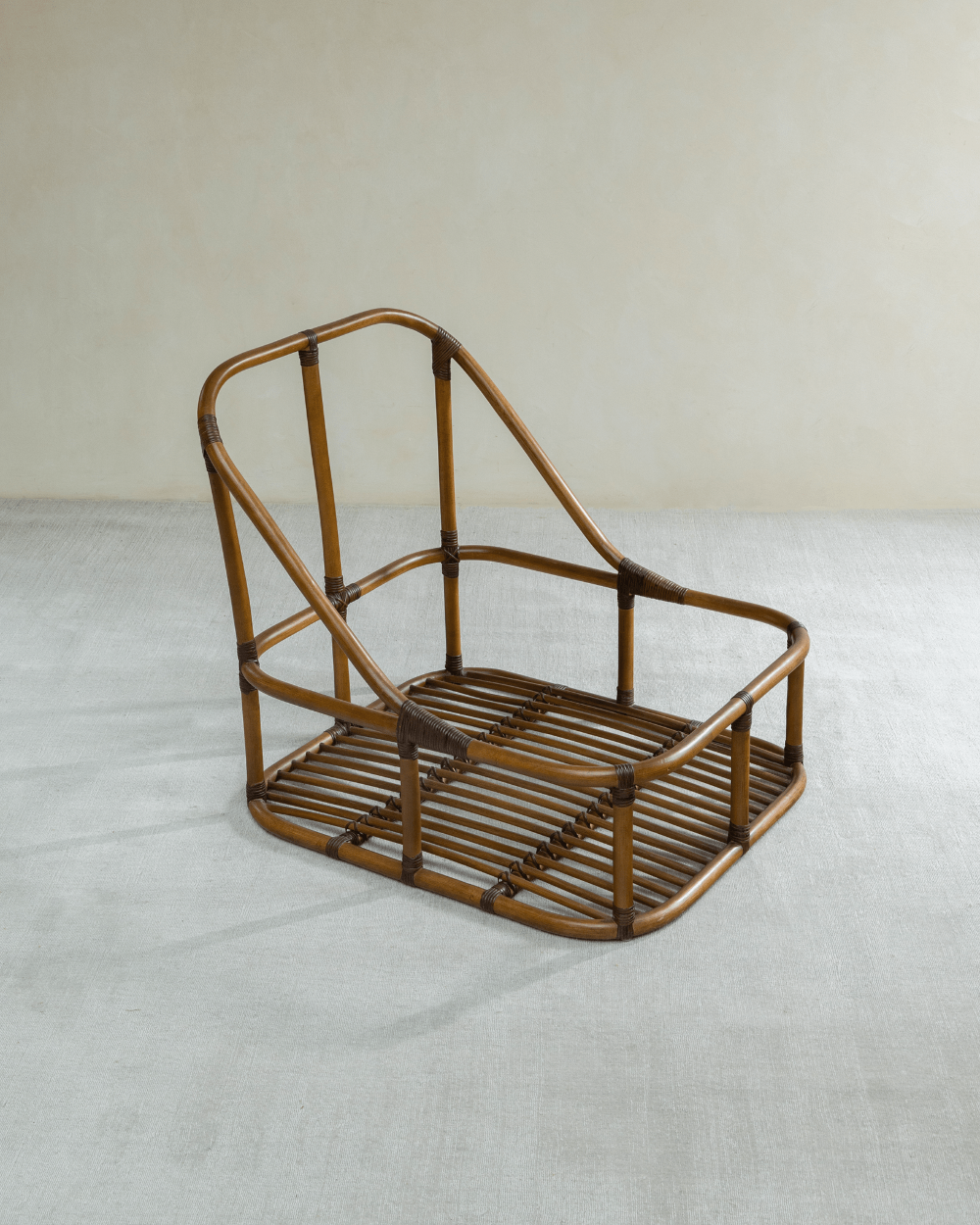 Tofu Lounge Sofa frame in natural rattan, showcasing spacious seating structure.