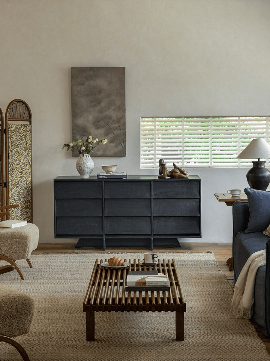 NO.9 Sideboard in a minimalist living room setting with reclaimed wood, nine drawers, and dark finish