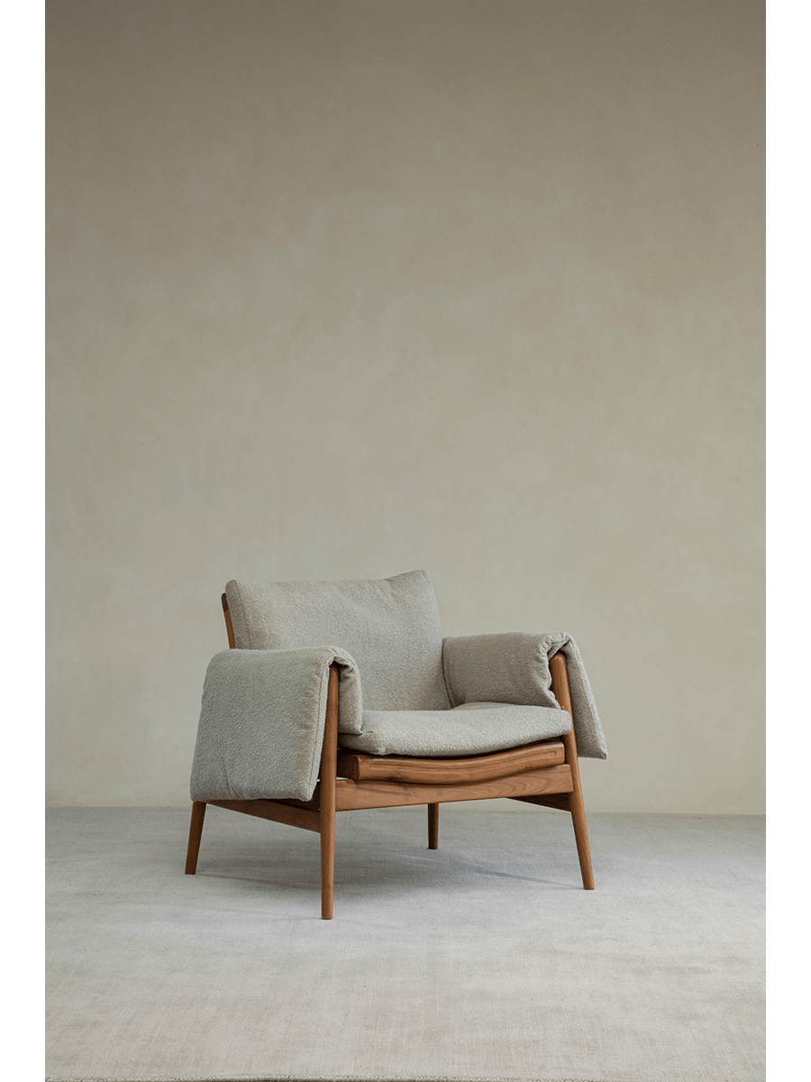 Teak wood garden lounge chair with light grey cushion and armrests