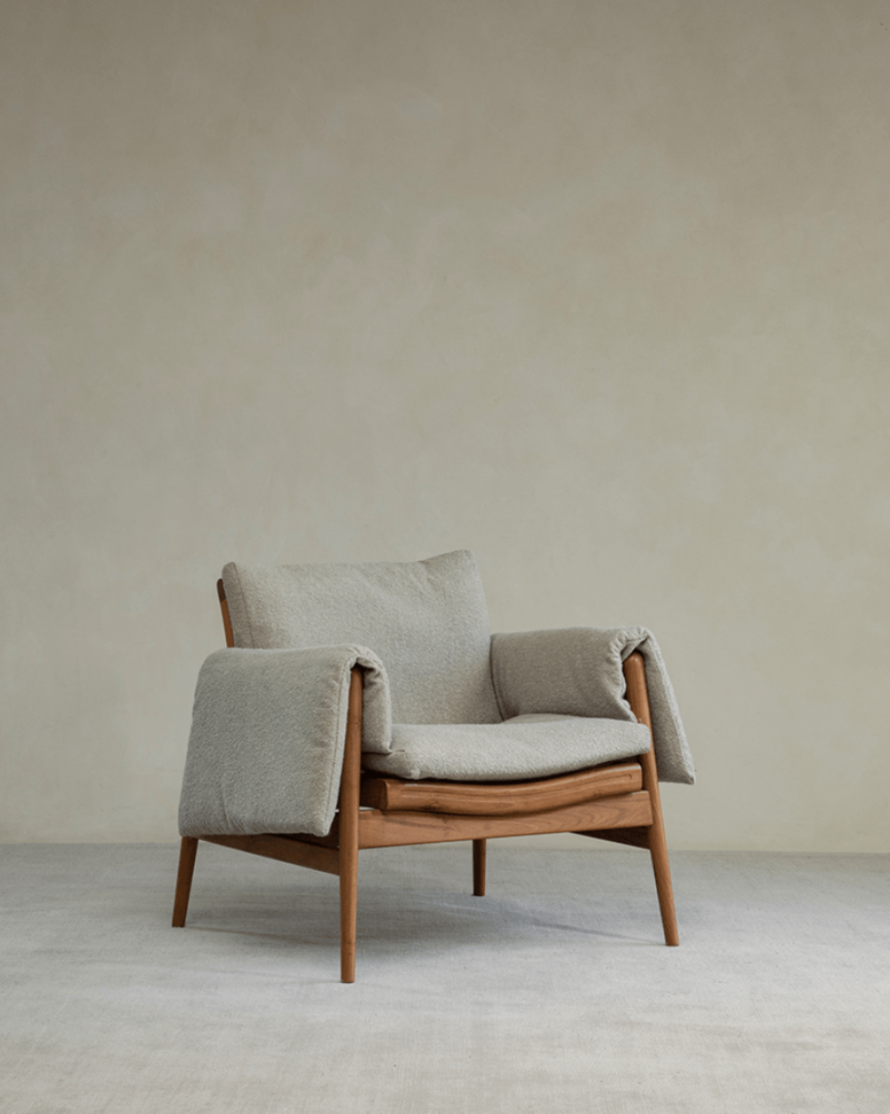 Teak wood garden lounge chair with light grey cushion and armrests