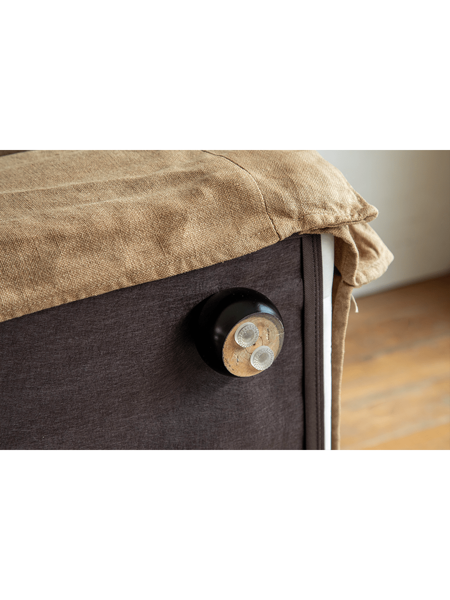 Skirt Linen Sofa detail: Beige linen fabric, modern design with dark brown base and wooden leg.