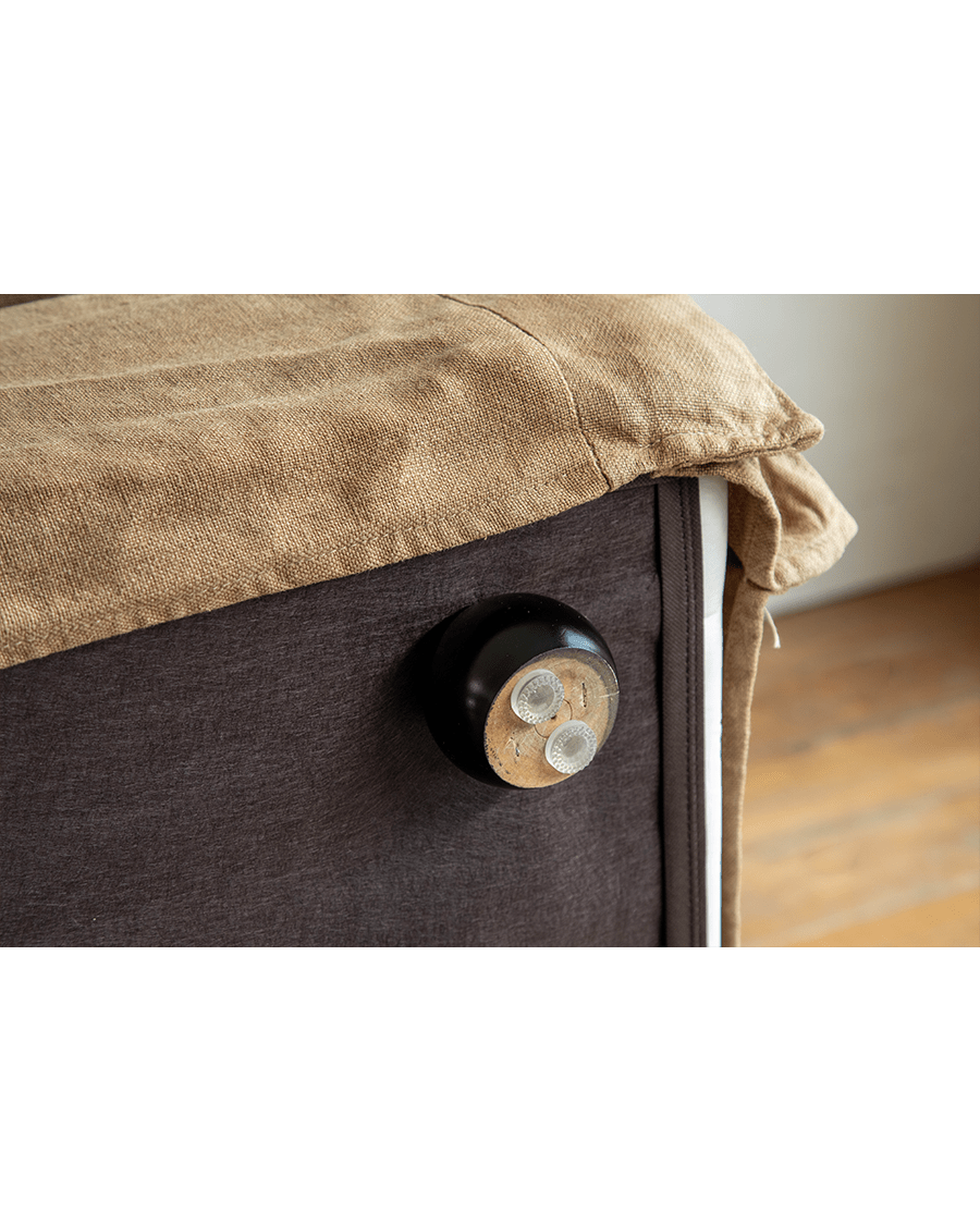 Skirt Linen Sofa detail: Beige linen fabric, modern design with dark brown base and wooden leg.